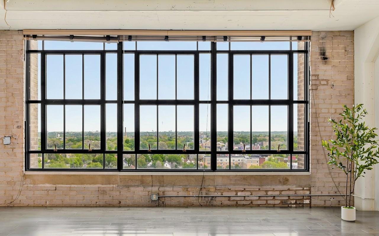 This property qualifies for a lender credit up to $5500 towards closing costs! Experience elevated city living in this stunning east-facing condo located in the historic Midtown Exchange Building. Situated on the 10th floor, this light-filled home offers stunning views, soaring ceilings, oversized windows, and an inviting open layout designed for comfortable urban living.The updated interior features fresh paint, a movable kitchen island, in-unit laundry, and a brand-new stainless steel refrigerator and dishwasher. Generous storage space and private resident parking—with the option to install an electric vehicle charger—add everyday convenience.Residents enjoy an impressive array of amenities, including a fitness center, theater/media room, 24-hour security, underground parking, and a rooftop community room and patio complete with grilling stations, seating areas, and planter boxes.Located directly above Midtown Global Market, you’ll have immediate access to a vibrant collection of restaurants, shops, and entertainment. Outdoor recreation is just steps away with the Midtown Greenway on one side and Powderhorn Park just two blocks from your door.With easy access to freeways, public transportation, pet-friendly living, and the ease of one-level living, this exceptional condo perfectly combines historic character, modern comfort, and an unbeatable community atmosphere.Limited number of Rentals allowed, rental cap is not met.