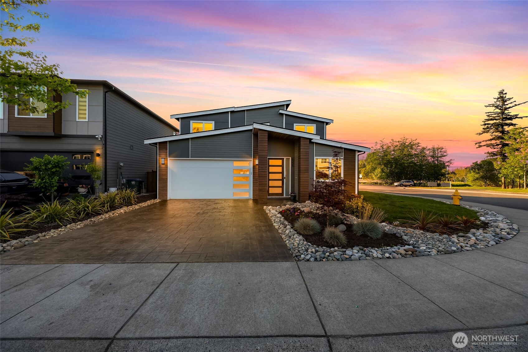 Like-new home on a desirable corner lot in Mallory Terrace! This spacious & modern designed 3-bedroom, 2.5-bath residence offers 2,200+ square feet of thoughtfully designed living space. The open-concept main level is filled with natural light and features a stylish linear fireplace with custom built-ins—perfect for both relaxing and entertaining. The modern kitchen boasts ample cabinet storage, stainless steel appliances, and a large island ideal for gatherings. The generous main floor primary suite includes a private ensuite bath, complemented by a versatile den or office which sits just off the entry, along with a convenient guest washroom and separate laundry area. Upstairs you will find two additional bedrooms, a full bath, and a large bonus room perfect for a media space, playroom, or home gym. This home backs up to a dedicated green space complete with walking trails. Conveniently located close to parks, schools & just minutes to I-5. This one is a must see!