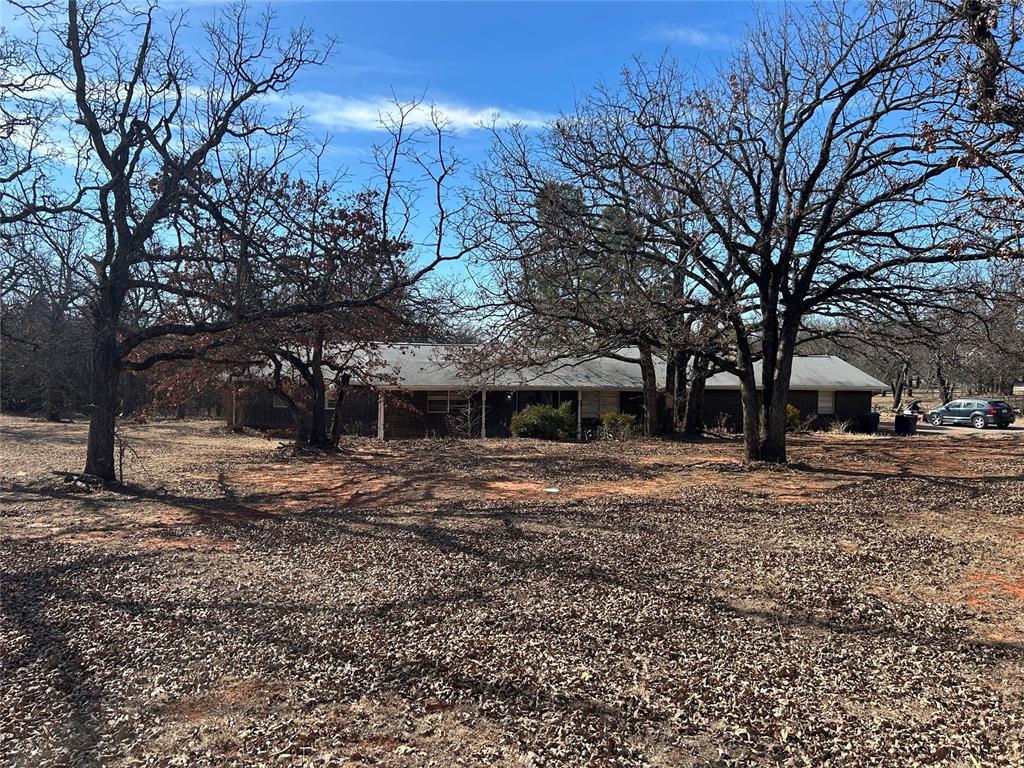 More photos coming soon!Country charm with room to make it your own! This 4-bedroom, 2-bath home offers a spacious living room featuring built-in shelving and a wood-burning fireplace that creates a warm focal point. The kitchen includes generous cabinet storage, plenty of counter space, and a dining area that connects easily to the main living space.The primary bedroom features a walk-in closet and direct access to the backyard, while the additional bedrooms provide flexibility for family, guests, or a home office. The covered back patio is perfect for relaxing outdoors and enjoying the open surroundings.Recent updates include a well water system replaced approximately two years ago, a new central heat/air pump installed in 2023, and two new toilets along with several updated faucets within the past year. The roof and siding were replaced in 2017 and include transferable warranties.Fun fact: This property was previously toured by film location scouts connected to productions such as Tulsa King and Sarah’s Oil.With quick access to I-40, I-240, Tinker Air Force Base, downtown OKC, Midwest City, and Choctaw, this home offers both convenience and opportunity. Schedule your showing today!