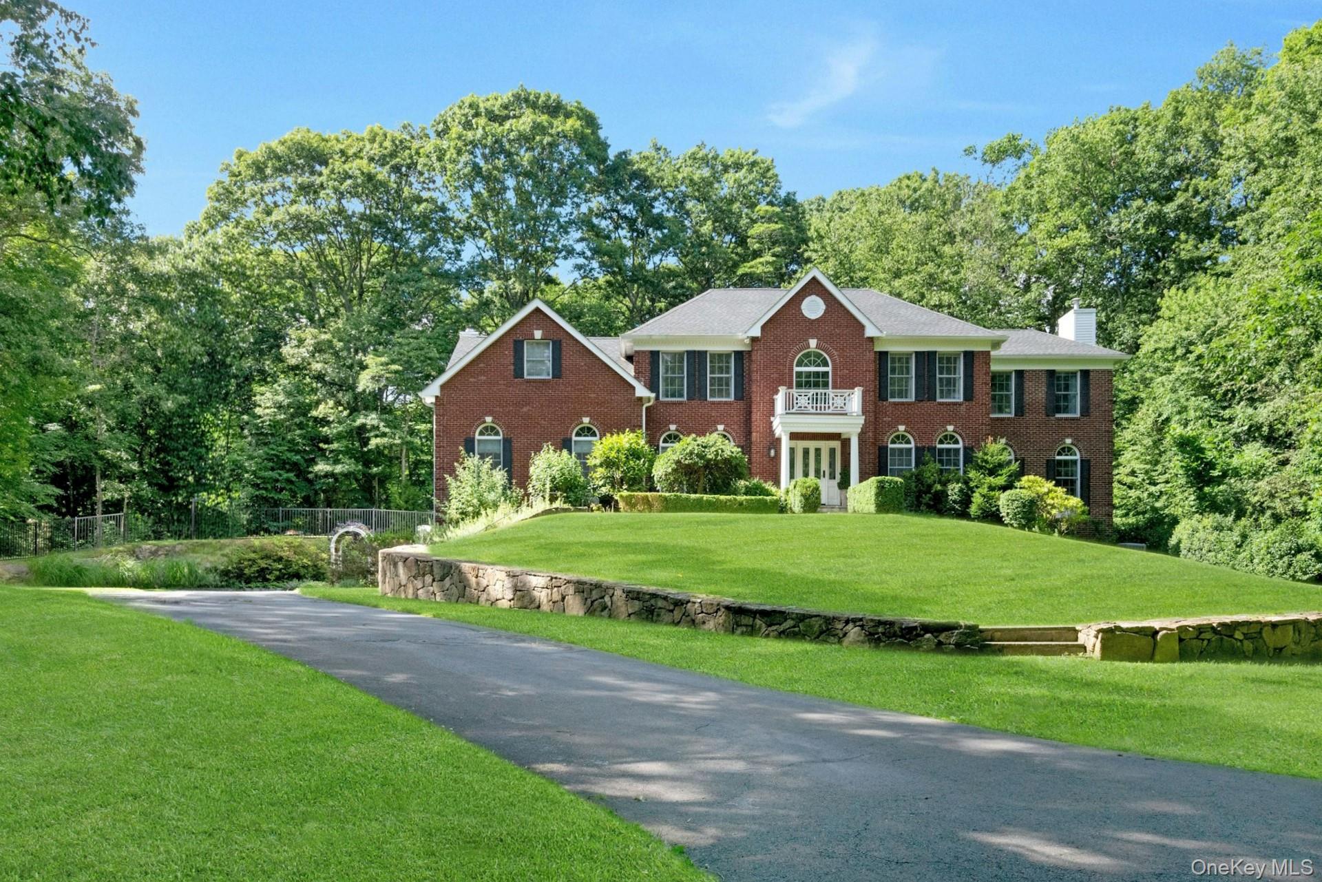 This home truly stands apart. A turnkey five-bedroom Colonial set on nearly three private acres, privately located at the end of a quiet cul-de-sac. Thoughtfully expanded from its original design, the home features an exceptional layout with remarkable versatility, perfect for entertaining, working from home, play areas, all designed to meet your lifestyle. At the heart of the home is a custom, top-of-the-line renovated kitchen, outfitted with high-end appliances including a commercial-grade Viking range. The main level showcases oversized, sun-filled rooms, beautiful wood floors, and custom built-ins throughout, creating a seamless flow with endless flexibility. Upstairs, the spacious primary suite is a serene retreat, complete with a sitting/dressing area and a beautifully renovated bath. Four additional bedrooms and two full bathrooms complete the upper level. Extensively updated inside and out, the home also includes a generator and new roof and gutters (2022). Located in the desirable Conant Valley Estates neighborhood in the Katonah-Lewisboro School District, with easy access to the New Canaan train station and just minutes from shopping and dining in Pound Ridge, New Canaan, and Vista.