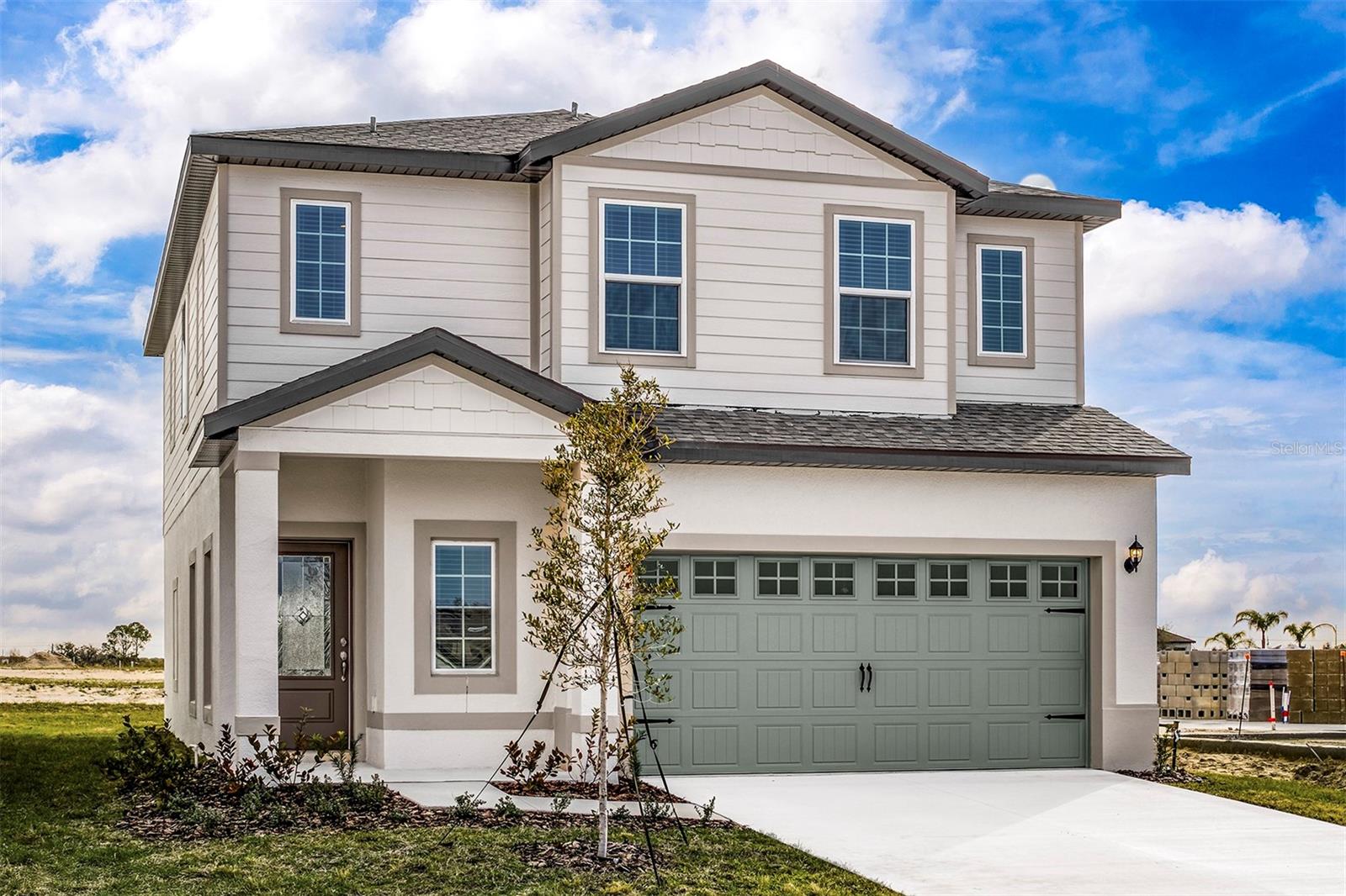 Pre-Construction. To be built. Welcome home to the Mangrove at Gum Lake Preserve, a beautifully crafted two-story home featuring four spacious bedrooms, two-and-a-half baths, and a two-car garage. Designed with growing families in mind, this thoughtfully designed layout includes stylish upgrades throughout and provides both function and comfort. The open-concept first floor is perfect for gathering, with a chef-ready kitchen showcasing an oversized island with a breakfast bar, ample counter space, and a large four-shelf pantry to keep your kitchen essentials in order. The kitchen flows naturally into the dining and living areas, making it easy to host guests or relax at home. A sliding glass door leads to the covered lanai, extending your living space outdoors.Upstairs, you’ll find all four bedrooms and a versatile loft area that can serve as a playroom, home office, or media room. The luxurious owner’s suite offers a peaceful retreat, with room for a king-sized bed and dresser, a spa-like bathroom with double sinks, a walk-in shower, and a spacious walk-in closet that provides generous storage.Enjoy charming outdoor spaces, including a long covered front porch and a beautifully landscaped yard. Located in the scenic Gum Lake Preserve, this community offers walking trails, a fishing dock, children’s playground, picnic spots, a boat ramp, and a community gazebo. With easy access to I-4, commuting to Tampa or Orlando is a breeze, and you’re never far from shopping, dining, and entertainment. The Mangrove is a perfect place to call home!Don't miss out on this incredible home in a community full of amenities! Schedule your tour today