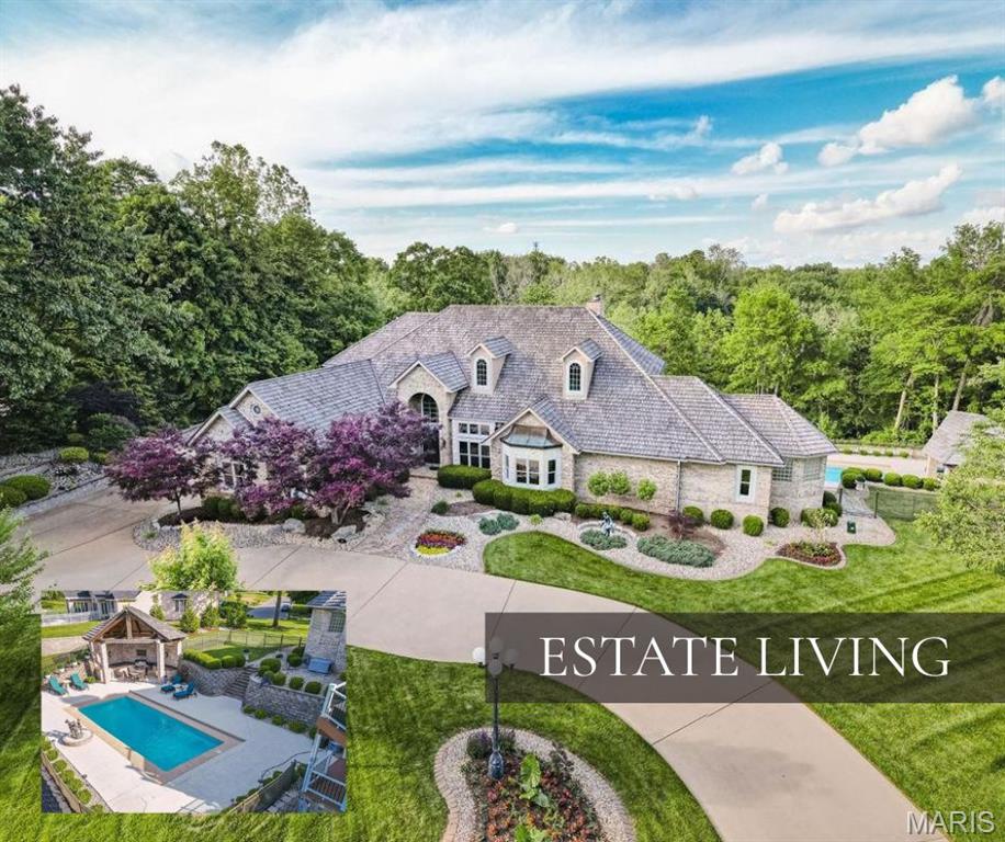 Nestled on a 9.31-acre estate in Edwardsville, this luxury property exudes sophistication. The stone & brick facade, circle drive, extensive landscape & three-car garage create a grand entrance. Boasting over 6400 sq ft, the interior features a stunning entry & staircase, wood flooring, a main-level master suite, hearth room, great room & an office. The upper level is stunning with 2 en-suite bedrooms and a remarkable sitting area. The outdoor space is an entertainer's paradise, with a heated inground pool, outdoor kitchen, multiple decks/patios and wooded privacy. Equipped with a whole-house generator, this residence ensures uninterrupted living. An improvement list is available upon request, showcasing the property's many enhancements by current owner. This Edwardsville gem seamlessly combines elegance, functionality, & comfort; offering a rare opportunity for refined living in a tranquil setting. Near interstate access, dining, & shopping. 3 parcels total the 9.31 acres. Roof 2020. Additional  Rooms: Wine Cellar