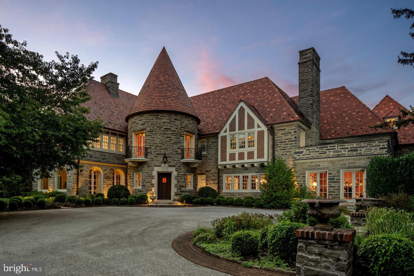 This quintessential Main Line estate, sits on more than 3 level acres of charming English gardens, rolling lawn, hedge fencing and tree lined entrance on a premier street. The stately Pennsylvania fieldstone home with its Ludowici tile roof stands perfectly on the property. Completely refinished by Ed Mahoney Builders, the finished product impeccably saved the beauty of the old while bringing every functioning piece to modern excellence. Whether indoors or out, there is endless grand scale or intimate entertaining. Family friendly mudroom (including separate cubbies, deep drawers and individual electronic hubs), high ceiling lower level with outdoor access (including a theatre/media room, bar/kitchen and a 3000 bottle capacity climate controlled wine cellar), nanny suite, exercise studio, original plaster moldings, commercial kitchen, irrigation, camera system, landscape lighting, marble finishes, study, sunroom and mahogany library are part of this fine residence.