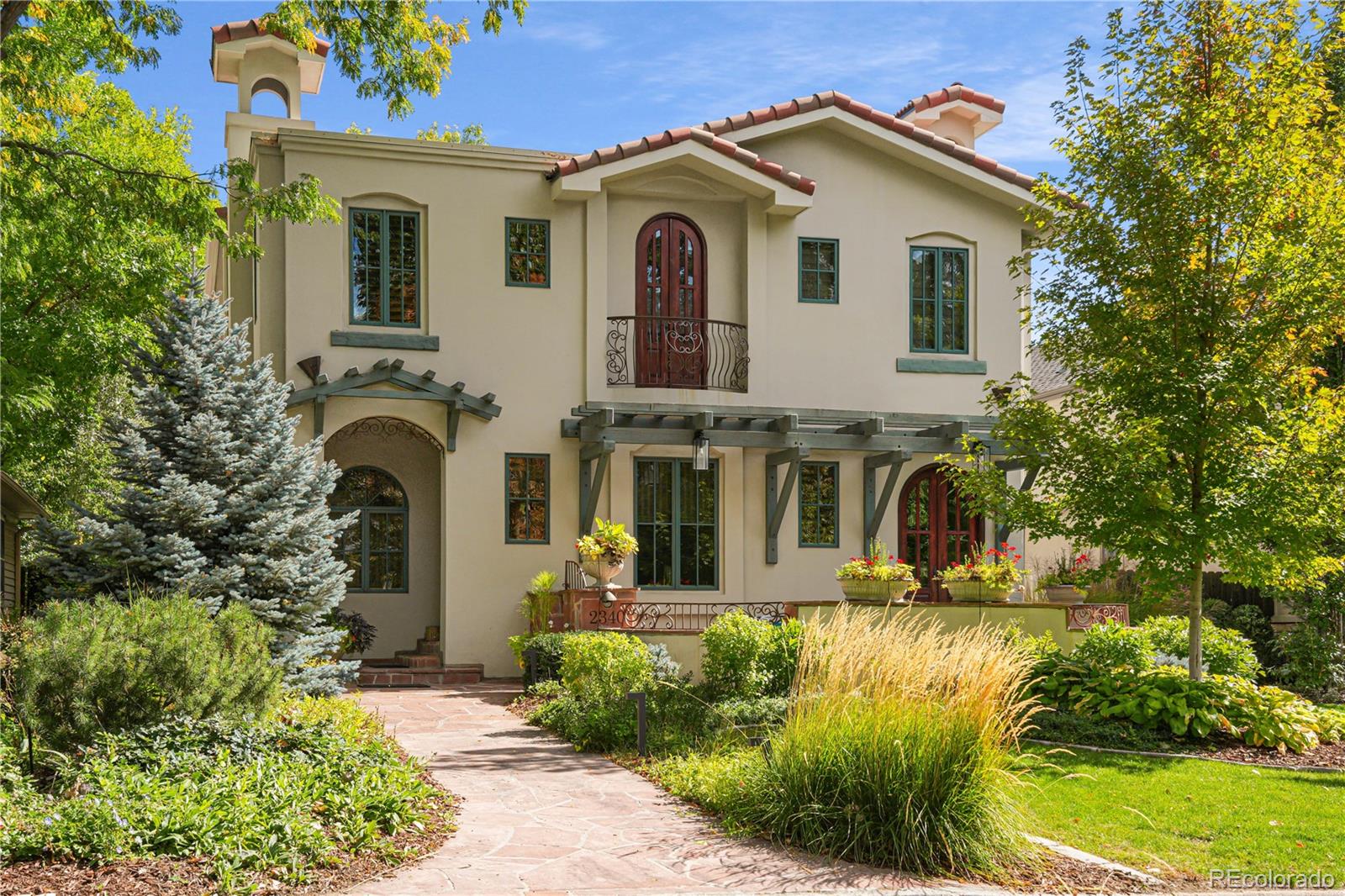 Welcome to this gorgeous Tuscan-style custom home in Observatory Park. Graceful, mature landscaping, a coveted street setting, and thoughtfully designed architecture come together to create a striking and refined curb appeal. Hardwood floors define the home with elegance and style. Five bedrooms. Five baths. No wasted space. Every line intentional. Inside, the plan unfolds with quiet confidence. The kitchen is command central. Expansive island. Precision layout. A front patio is west facing with plenty of light and space to enjoy your morning coffee. The back patio extends your living experience outdoors with a gas fireplace and private yard. Upstairs, the primary suite offers a five-piece bath, thoughtfully designed with refined substance. Two additional bedrooms, one with an en-suite bath and a 3/4 shared bath, on the top floor. Below, the finished lower level offers a full bath and additional two bedrooms or make one a workout space. A full wet bar and temperature-controlled wine cellar, complete the space. Plenty of storage. Home includes a solar thermal system for improved energy efficiency. System is currently under a lease-to-own agreement. Minutes from Denver’s best parks, schools, and dining. Close enough to access everything. Far enough to live with quiet and privacy. Welcome home.