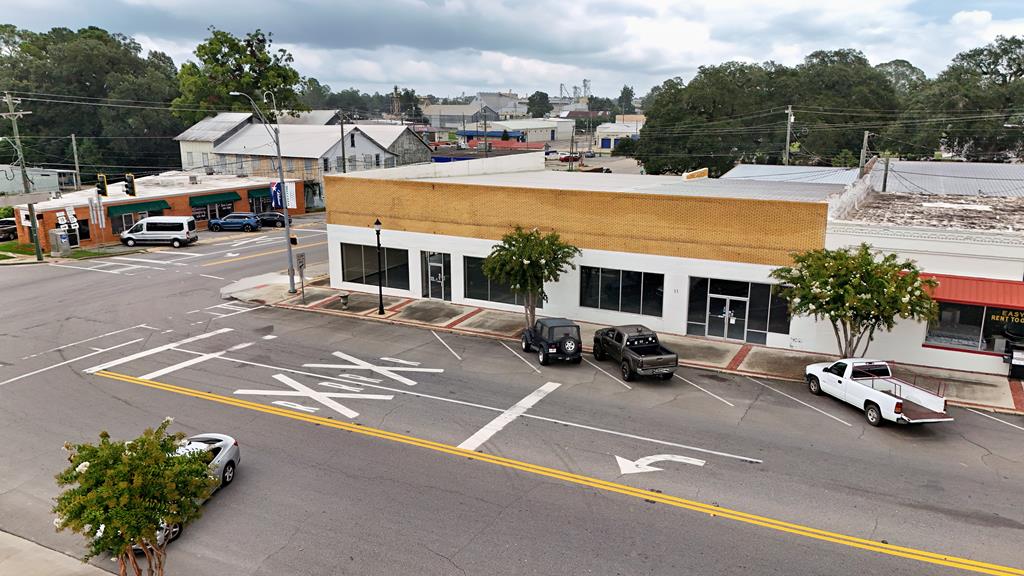 Versatile 9,200 Sq. Ft. Commercial Space in Downtown Camilla. This spacious property offers endless potential in a prime downtown location. Recently updated with new roof, modern HVAC system, and fresh interior and exterior paint; it's move-in ready and built to impress. Designed for flexibility, the building can easily be divided into two separate units, each featuring its own private office space and restroom—ideal for dual tenants or multi-use operations. A large storage area in the rear adds even more functionality. Whether you're envisioning retail, office suites, or a creative mixed-use concept, this property is a blank canvas with room to grow. Call your favorite agent today for your personal tour!