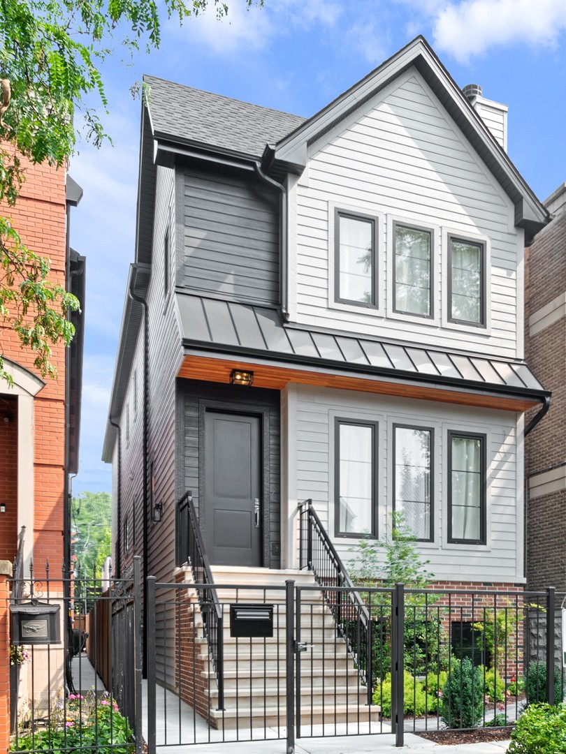 6 bed, 4.2 bath new construction home on a tree-lined, one-way street in Lakeview, just a short walk to vibrant Hamlin Park. Formal living room with wood-burning gas fireplace flows into the adjoined dining room, which features a wet bar and wine fridge. The chef's-grade kitchen includes Sub-Zero, Wolf, and Bosch appliances, oversized island with waterfall countertops, and walk-in pantry. Adjacent family room features a gas fireplace with custom built-ins and leads down to a tiled mudroom and out to a brick paver patio and 2-car garage with tiled rooftop deck. The primary suite is distinguished by vaulted ceilings, dual walk-in closets, and a gorgeous bath with freestanding tub, steam shower, dual vanities, and heated floors. The second and third bedrooms are served by a shared bathroom featuring a dual vanity and tub/shower combination, and the fourth bedroom boasts vaulted ceilings, a walk-in closet, and an en-suite bathroom with walk-in shower. A laundry room with front-loading washer and dryer completes the second level. The lower level features radiant heat and includes a spacious recreation room with wet bar and beverage center, office/bedroom, powder room, and en-suite guest bedroom. White oak floors on main and upper levels, LVT on lower level. Seller-developer is a licensed Illinois Realtor.
