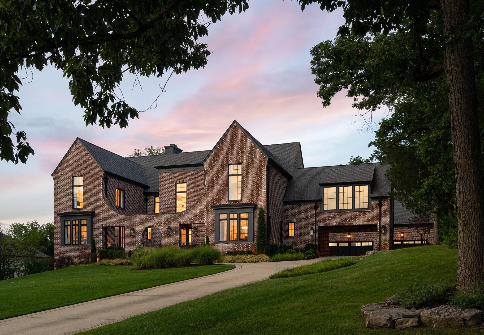 Rarely does an opportunity come available where you can live on over an acre AND walk or bike to the Mall at Green Hills. With 4520 Shys Hill Road, that's exactly what you get. Only 1.5 miles to The Mall at Green Hills, 0.5 miles to Green Hills Park, and 3 miles to 12 South or Hillsboro Village. Custom built in 2021, the home’s design maximizes its commanding presence and flow with multiple courtyards and a large backyard prepped for a pool. The entrance features a vaulted ceiling in the main hallway and access to the two-story great room. The common spaces offer a seamless indoor-outdoor entertaining experience. The gourmet kitchen and prep kitchen are perfect for hosting, and the bedrooms provide a “retreat-like” feel. Also included is a temperature and humidity-controlled wine cellar, concrete storm shelter room, gym, and more. Inquire today to view this stately home!