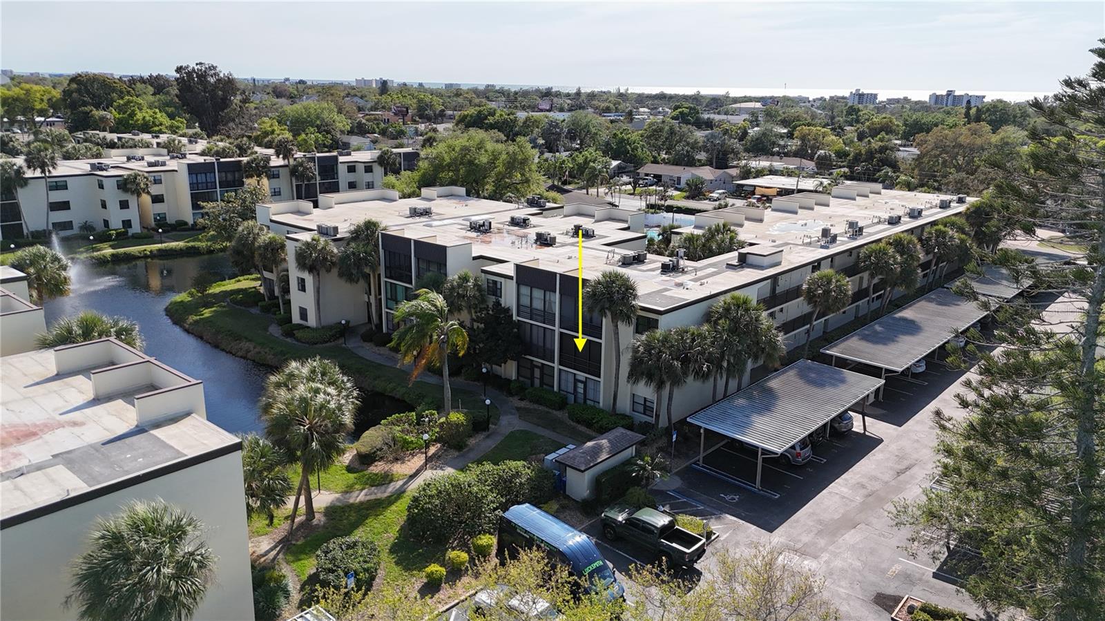 Elevate your living with this 2nd floor END-UNIT! Located in the 55+ & better community of Lakeview of Largo South Condo, featuring 2 bedrooms, 1.5 bathrooms, and nearly 900sqft of living space. The kitchen offers warm cabinetry and solid countertops, ready to take on meal times and preparations! The convenient breakfast bar connects the kitchen to an expansive living room, showcasing water views from any angle. Your living space is ILLUMINATED by the natural light coming in through the LARGE sliding doors that lead out to your SCREENED IN LANAI! Outdoor space is a must-have to enjoy all of Florida's beautiful weather. Neutral toned paint makes it easy to customize this unit to fit your style, while LVP FLOORING THROUGHOUT offers a seamless transition from room to room! The primary suite boasts an impressive size, while the primary bath offers XL counter space, a full tub/shower combo, and a generous WALK-IN CLOSET. You and your guests will appreciate the additional 1/2 bathroom located directly off of the second bedroom. Can't forget to mention... both bedrooms are topped off with PLANTATION SHUTTERS, and the washer and dryer are in the unit! No lugging your laundry around here! Residents enjoy the LOW MAINTENANCE LIVING of the condo life, where you can make friends at your community pool/spa and bocce ball, or stroll along the sidewalks between buildings. Located just minutes away from shopping/dining, Indian Rocks Beach, with a short drive to Saint Petersburg, Clearwater, and the airport... This condo has it all! The only thing missing is YOU!