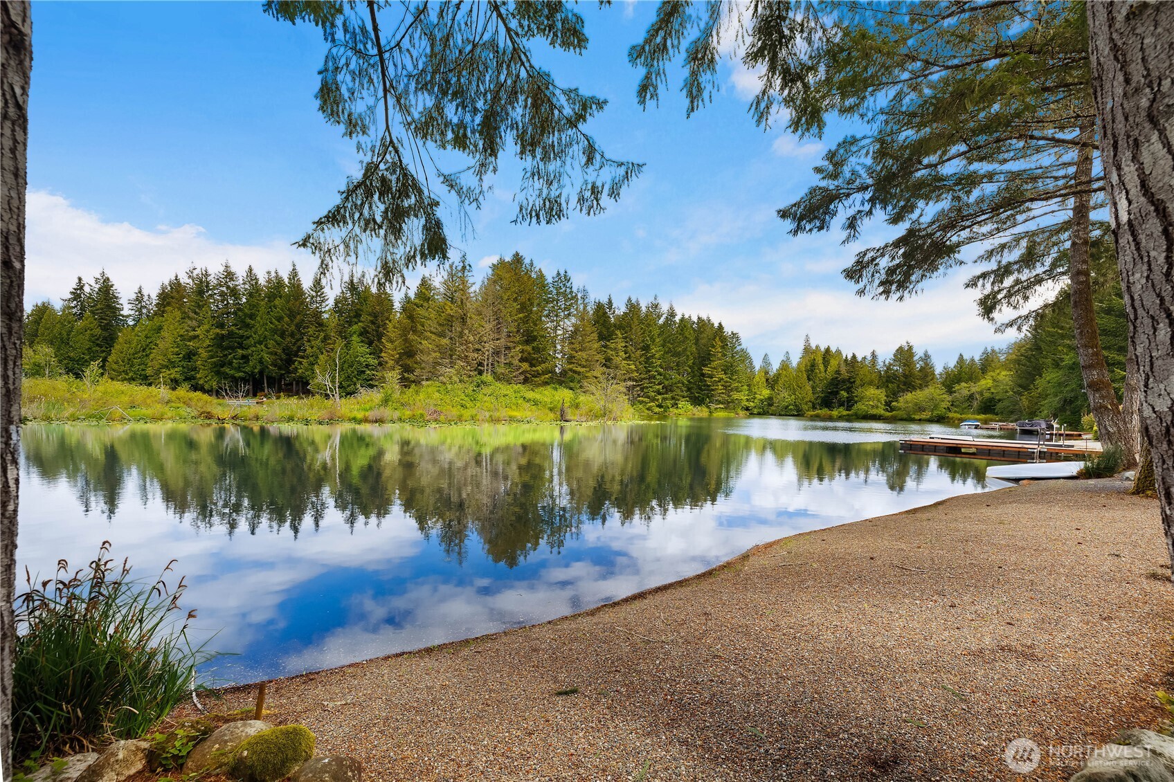 Lake days start here—62 feet of no-bank waterfront puts you right at the water’s edge, ready for morning coffee, afternoon swims, and sunset evenings on the deck. This 3-bedroom, 2.25-bath home offers 1,616 sq comfortable living.  This home has been well maintained and updates made along the way that make it feel fresh and move-in ready. Brand new carpet runs throughout, while whole-house air conditioning keeps things cool all summer long. Natural light fills the living spaces, with views that keep the lake front and center. Views from both bedrooms, dining room, and great room. Step out to the Trex deck and take it all in—perfect for entertaining or simply unwinding after a day on the water. The low-maintenance landscaping means less upkeep, more enjoyment. A freshly graveled driveway adds a clean finish and provides plenty of parking, including space for your RV and all your lake toys. Built in 1989 and thoughtfully updated, this home delivers the lifestyle Lake Limerick buyers are after—simple, fun, and centered around the water.  Lake Limerick offers 2 lakes, 9 hole golf course, pro shop, cafe, private restaurant and lounge, trails, parks, playgrounds, and events all year long.