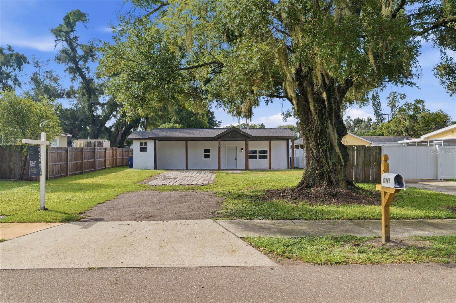 Virtually Staged. SPACE, COMFORT, AND CONVENIENCE IN THE HEART OF TAMPA! Welcome to 1707 E Frierson Avenue, a charming 3-bedroom, 2-bathroom home offering 1,354 square feet of living space, a functional layout, and plenty of room to make your own! Situated on a 5,876-square-foot lot, this property combines comfortable indoor living with generous outdoor space and a convenient central Tampa location. Step inside to discover an inviting interior featuring a combination of laminate and vinyl flooring, an OPEN LIVING AND DINING AREA, and a practical layout designed for everyday living and entertaining. The kitchen features solid wood cabinetry, solid surface countertops, and a functional design that makes meal preparation and daily routines a breeze. Three bedrooms and two full bathrooms provide flexibility for guests, additional living space, or a dedicated home office. Outside, enjoy a SPACIOUS YARD with plenty of potential for weekend cookouts, outdoor gatherings, gardening, or creating your own backyard retreat. The extended driveway also provides convenient off-street parking. LOCATION IS A MAJOR PLUS! Situated in an established Tampa neighborhood, this home offers convenient access to I-275, I-4, Downtown Tampa, Seminole Heights, and the surrounding Tampa Bay area. Enjoy proximity to popular destinations including ZooTampa, Busch Gardens, local parks, shopping, restaurants, and everyday conveniences. Whether you're looking for a place to call home or an opportunity to add your personal touch, this property offers a combination of FUNCTIONAL LIVING SPACE, OUTDOOR POTENTIAL, AND CENTRAL TAMPA CONVENIENCE. Don't miss your opportunity to make 1707 E Frierson Avenue your own! Schedule your private showing today!
