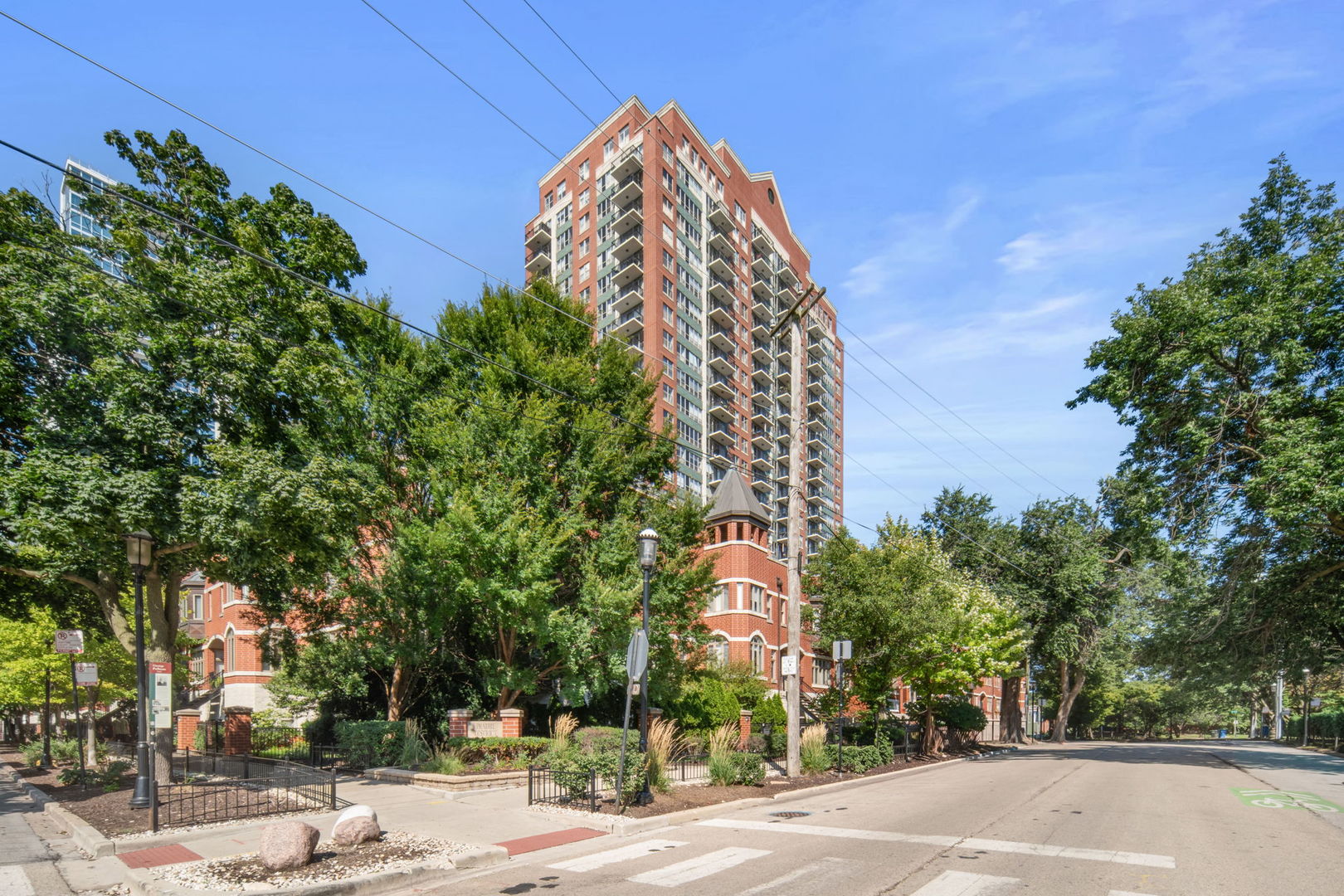 Welcome home to this sunlit west-facing condo with 180 panoramic city views in the historic Prairie District. An open floor plan flows seamlessly with hardwood floors and a chef-inspired kitchen featuring granite counters, an island, and custom Viking appliances-all included. The bedroom has been elegantly transformed with a fully customized Closets by Design system, offering a seamless blend of luxury and functionality. Thoughtfully tailored to the space, this built-in wardrobe features refined finishes, integrated lighting, and a harmonious mix of hanging space, soft-close drawers, and open shelving. Designed to elevate everyday living, this bespoke installation brings a boutique dressing room experience into the comfort of home.. The oversized balcony is ideal for entertaining or enjoying sunsets. The primary suite offers a walk-in closet and a spa-style bath with dual sinks and a glass shower. Building amenities include 24-hour door staff, fitness center, sauna, dog run, bike room, and on-site dry cleaning. Steps from Soldier Field, the lakefront, Burnham Harbor, Mariano's, and public transit. Parking available for additional $30,000.