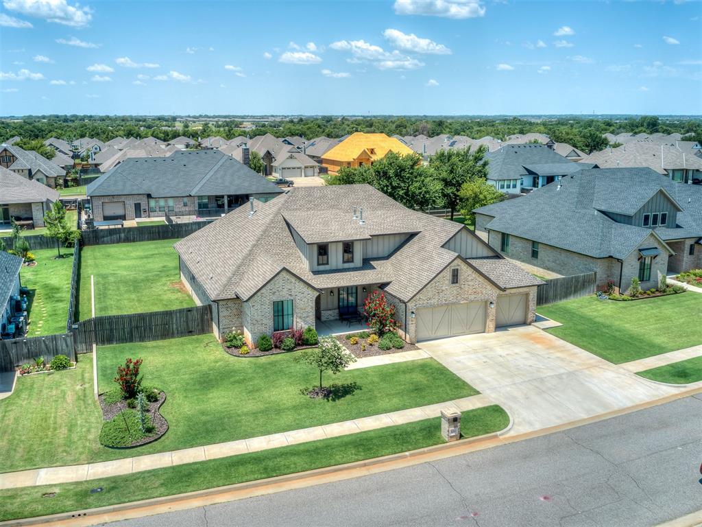 Better than new, this thoughtfully designed home offers 4 true bedrooms, a dedicated office, plus a convenient pocket office, creating flexible spaces for working, studying, or staying organized. The open-concept living room showcases vaulted ceilings and beautiful white oak hardwood floors, flowing into a chef's kitchen complete with double ovens, a gas range, apron-front composite sink, coffee bar, and oversized walk-in pantry. The private primary suite features vaulted ceilings with exposed beams, a freestanding soaking tub, dual vanities, a walk-in shower with dual shower heads, and exceptional storage. Secondary bedrooms include a Jack-and-Jill bath, while the additional guest bedroom and full bath provide an ideal layout for family or visitors. Outside, enjoy a spacious, flat backyard with room for a future pool, a covered patio, full-yard Wi-Fi-enabled Rain Bird sprinkler system, smart garage door openers, 240V garage wiring for EV charging or a generator. Combining beautiful finishes, smart upgrades, abundant storage, and a highly functional floor plan, this home offers the perfect blend of comfort, style, and everyday convenience.