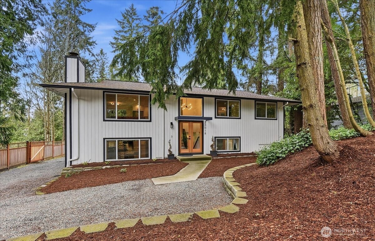 Need a little more room? With a 17,860 sqft lot you have plenty. It comes with it's own private woods to explore and build stuff in.  Outside, the fully fenced rear yard offers plenty of space to play, garden, or relax. From summer BBQs on the expansive deck to cozy evenings on the patio, this outdoor space is made to be enjoyed year-round. Nice big seperate garage/shop waiting for your projects. Lots of parking behind the fence, several out front. The lower level has a seperate living space with it's own kitchen, full bath and laundry. If you don't need it that way it also blends in to the home as just more space. or an office? There is also a large play room with direct patio access making parties easy. Too much screentime? Behind the back fence is a private fully fenced woods waiting to be explored. This great home was fully remodelled 3 years ago and still shows as new with a Chef's Kitchen, Quartz Counters, big breakfast island and stainless steel appliances. It backs up to Brier Elementary school and its so quiet that you can hear owls hooting at night.