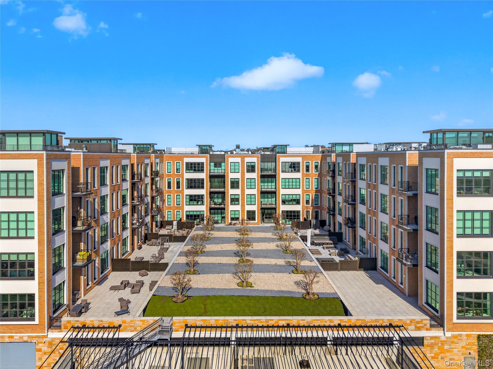 Welcome to this exceptional modern condo in the heart of Glen Cove. The Beacon At Garvies Point is a new development situated right on the Glen Cove Creek and the Hempstead Bay waterways, and features a vast array of amenities for improved quality of life. This oversized bright and spacious unit features an open layout, beginning with a beautiful entrance foyer, with a living and dining room, open kitchen, master bedroom with an en-suite full bathroom and walk in closet. 2 additional bedrooms and 2 additional full bathrooms follow. This unit also features a grand rooftop terrace with a grilling area, perfect for outdoor entertainment. Washer and dryer in unit. The building features amenities such as a large seasonal pool, gardens, concierge, doorman, billiards room, conference room, residents lounge, yoga center, movie theatre, library, outdoor kitchens, catering kitchen, package/mail room, garage parking, and storage. This unit comes with 2 garage spots which are spots #63, and #108 which features an EV charger. Storage unit #180 also comes with this unit. Close to shops, restaurants, parks, and schools. Close to the Sea Cliff LIRR station. Close to the N21 bus. Don't miss this chance to own this beautiful condo!