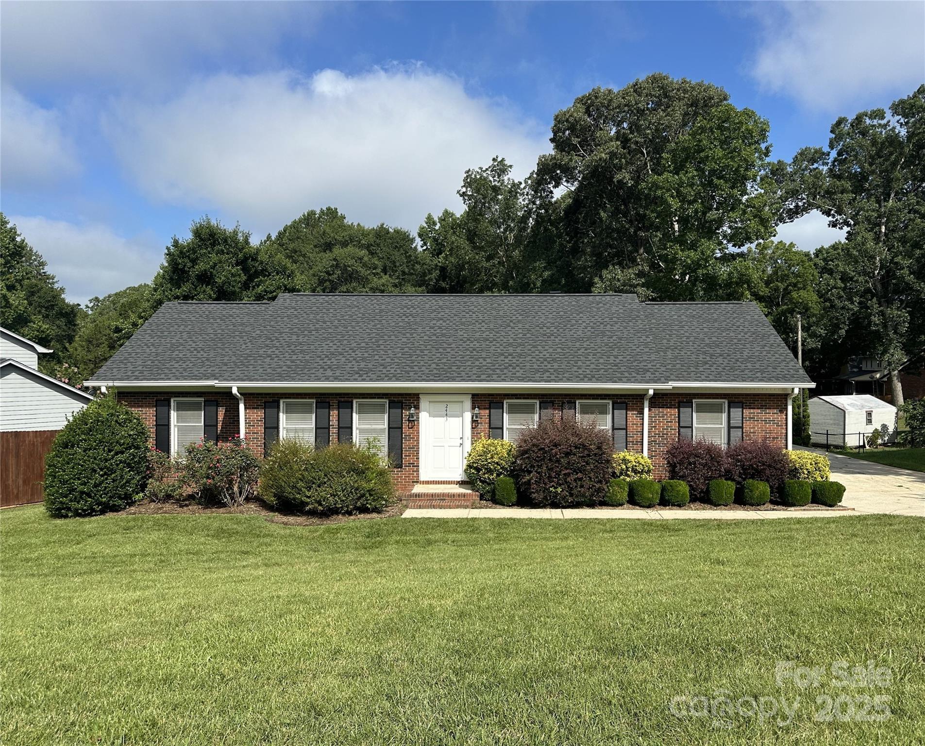 Recently transformed 3 bedroom, 2 bath, full brick home desirably located on a quiet street just off HWY 127 in NW Hickory! Many recent improvements to this 1-level home! Buyers will appreciate the new luxury vinyl plank flooring throughout the open floor plan, which also boasts a freshly painted interior! The kitchen has a beautiful new granite counter and new stainless Whirlpool appliances. The wood-burning fireplace is the focal point of the living room, which is generous enough in size to create two seating areas, or use a portion of the space for a home office. The dining area could also easily be utilized differently depending on the desire of the new owner. The primary bedroom  offers a walk-in closet and beautifully updated bathroom with newly tiled floor, bath/shower surround and quartz counter. Two additional bedrooms and another updated bathroom complete the floor plan with a main level laundry. The carport has a large utility closet for storage.