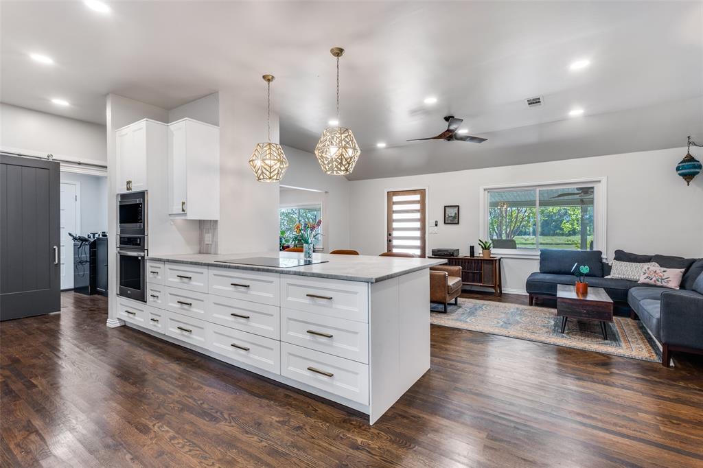 Incredible opportunity if you are looking for a multi-generational property, an investment property, or both! Over 1.2 acres in McKinney, and zoned to McKinney ISD, with easy access to SH 121, I-75, and Hwy 380. The main home offers over 2,400 sq ft with 5 bedrooms, 3 full bathrooms, and 2 living areas.  Flex space between kitchen and garage, currently used as a hair salon, is a great option for multiple uses.  You'll notice the beautiful wood flooring upon entry and immediately be drawn to the recently renovated kitchen.  Features include formal dining room, two living areas, one with a cozy fireplace and access to the back porch, and an over-sized laundry room.  Recent paint, door hardware, and bathroom faucets add to this already amazing home.  Solar panels save you on utilities, ensure you have power during outages, will be paid off by seller at closing. The 1,800 sq ft manufactured home includes 3 bedrooms, 2 baths, a formal dining area, and an over-sized back deck that can accommodate large gatherings. The split bedroom layout provides a private master suite separate from the other two bedrooms.  This is an ideal home for family, guests, or tenants.