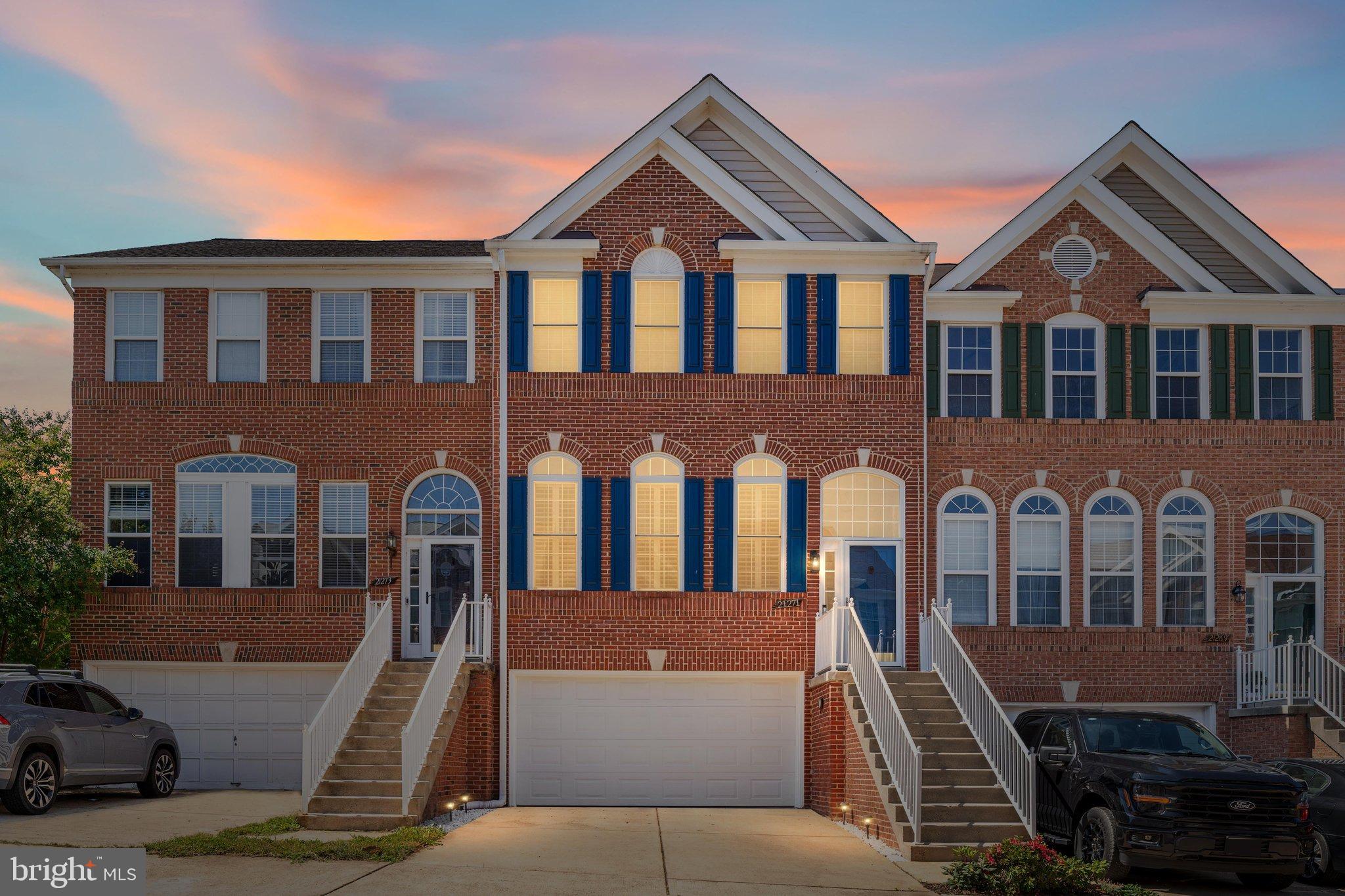 Beautifully updated and move-in ready, this Ashburn Village townhome offers an exceptional combination of space, upgrades, and peaceful waterfront views. One of the standout features is the outdoor setting, with a spacious partially covered Trex deck overlooking the lake, which is an ideal spot for morning coffee, outdoor dining, or watching the sunset. A stamped concrete patio below provides even more space to relax and entertain.Inside, the home features hardwood flooring throughout the main level, plantation shutters, and a two-level bump-out that adds valuable living space. The kitchen has been refreshed with granite countertops, additional cabinetry, a new backsplash, under-cabinet lighting, and premium LG appliances, including an induction range with convection and air-fry capabilities, counter-depth French door refrigerator, dishwasher, and microwave/convection oven. Just off the kitchen, the inviting family room features a cozy fireplace and direct access to the deck.The finished lower level offers excellent flexibility with a legal bedroom, full en-suite bath, and walkout access to the rear patio, perfect for guests, a home office, or additional living space. The garage has also been thoughtfully improved with refinished walls, an epoxy floor, additional storage, and a Level 2 ChargePoint EV charger. Major updates include a newer roof(2021), energy-efficient double-hung windows (2021), premium washer and dryer, updated kitchen appliances, upgraded electrical circuits, 6-inch gutters with gutter guards, and a new water heater (2026).  Living in Ashburn Village means having an incredible variety of amenities right outside your door. The community features the Ashburn Village Sports Pavilion, multiple indoor and outdoor pools, tennis and pickleball courts, fitness facilities, playgrounds, scenic lakes, athletic fields, and an extensive network of walking and biking trails. Everyday conveniences are also close by, with shopping, dining, grocery stores, and other essentials just minutes away. With its outstanding amenities, convenient location, extensive updates, and beautiful water views, this home offers a rare opportunity to move in and enjoy from day one.