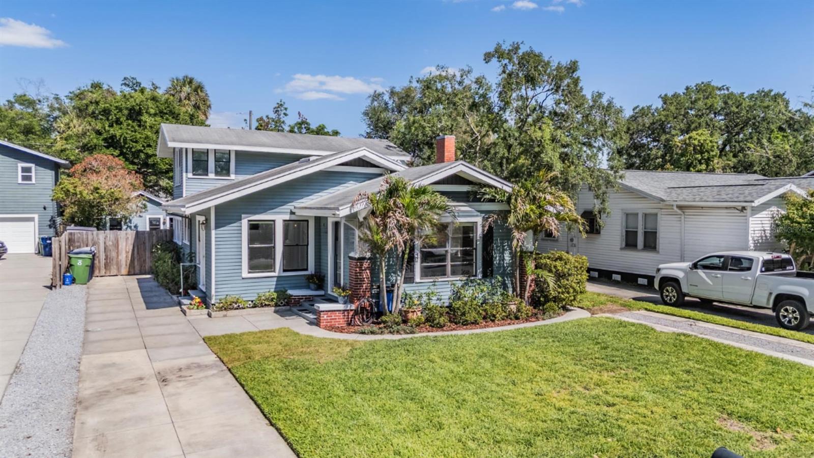 One or more photo(s) has been virtually staged. Welcome to your Seminole Heights bungalow—where historic charm meets modern living in one of Tampa Bay’s most connected and vibrant neighborhoods. Perfectly positioned for young urban professionals, this fully updated 4-bedroom, 2-bath home offers not just style and convenience, but smart flexibility with a private income-producing casita out back.  Step inside to an airy open-concept great room, where soft gray luxury vinyl plank flooring flows throughout the main level. The thoughtfully designed dining space features custom built-ins and overlooks the front yard, seamlessly connecting to the living area. Crown molding and a cozy electric fireplace add warmth and character, creating a space that feels both elevated and inviting.  The kitchen is designed for both everyday living and entertaining, featuring marble countertops, stainless steel appliances, a walk-in pantry, and a pot filler for added convenience. French doors lead out to a paver patio—ideal for weekend cookouts, evening gatherings, or simply enjoying the Florida lifestyle.  A flexible bonus space off the main living area makes the perfect home office or creative studio—ideal for remote work. The primary suite is conveniently located downstairs with a full bath and generous closet space. Upstairs, two additional bedrooms with a 2025 mini-split system provide comfort and privacy for guests or roommates. A fourth bedroom at the rear of the home offers direct backyard access and laundry space.  Out back, the detached 324 sq ft casita opens up a world of possibilities. Complete with its own updated kitchen, stainless steel appliances, private bedroom, and bath, plus a raised ceiling for added space with new 2025 AC—it’s perfect as a guest suite, private office, or rental opportunity. Whether you’re looking to offset your mortgage with passive income or create a separate live/work setup, this space delivers.  Major updates include a 2024 HVAC system with new ductwork, tank-style water heater 2026, updated electrical, fresh sod and irrigation 2022—ensuring peace of mind and move-in readiness. Walking distance to elementary, middle and high schools along with the Hillsborough River, River Crest Park, Local coffee shops, restaurants and bars for the utmost enjoyment.  Located just minutes from downtown Tampa, with quick access to I-275 and all the hotspots across Tampa Bay, this home offers the ultimate blend of character, convenience, and opportunity.