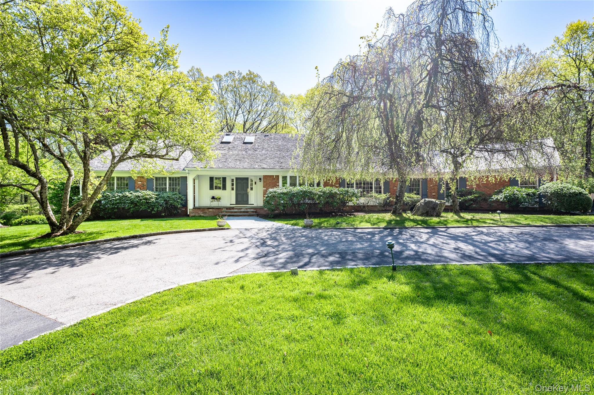 Introducing an exceptional offering in the prestigious Whippoorwill neighborhood of Armonk. Privately set on 2 beautiful landscaped acres, this expansive residence offers over 6,000 square feet of refined living space and the flexibility of a 5 bedroom home that lives like a 6 bedroom. Designed for both entertaining and comfortable living, the sun-drenched, renovated chef’s kitchen opens seamlessly to a spacious family room, with walls of windows that frame picturesque views of the bucolic property. The main level features a luxurious primary suite along with two additional bedrooms, while the upper level offers two generously sized bedrooms/bathroom. A substantial mudroom and a office/guest suite with ensuite bath provide functionality and convenience. The large walk-out finished lower level, complete with a full bath, fireplace and wine cellar offers over 1,500sf.  Meticulously maintained throughout, notable features include a cedar shingle roof and a automatic generator. Ideally located just minutes to the heart of Armonk, this distinguished home offers the perfect blend of privacy, scale, and sophistication.