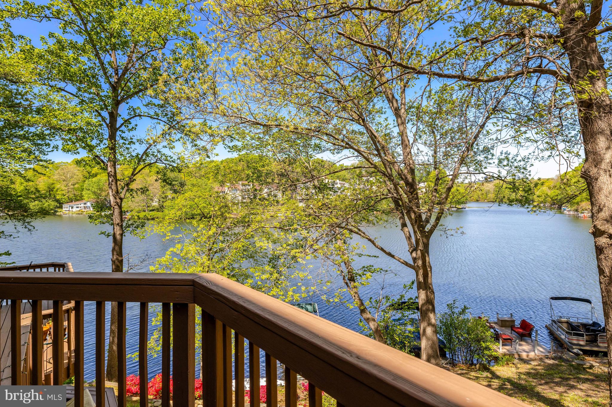 Welcome to waterfront living at 11024 Thrush Ridge Road, nestled along the shoreline in the Lake Audubon Terrace Cluster! This townhome is light and bright with an open and contemporary design! As you enter the home, the living room sets the tone with hardwood floors, recessed lighting and an open and inviting setting. The table-space kitchen is ready for you to enjoy - featuring granite counters, awesome storage and prep space, stainless steel appliances, recessed lighting, undercabinet and pendant lighting and tiled floors. Atrium windows provide a light-filled dining area next to the kitchen. The sliding glass door leads to the main level deck providing incredible lake views. The deck provides plenty of space for dining and entertaining, with a setting you will love throughout the seasons. The primary suite is a tranquil retreat with a vaulted ceiling, skylights, hardwood floors, a walk-in closet and an ensuite bath. The primary suite also features a wall of windows overlooking the lake, offering beautiful lakefront views. Bedrooms #2 and #3 feature spacious closets, neutral carpet and fresh paint. There is a full hall bathroom and a laundry closet with a stacked washer and dryer on this level as well. There is another standard-sized washer and dryer on the lower level. The walk-out lower level features another full hall bathroom and the recreation room with a gas fireplace and a sliding glass door leading to the lower-level deck. This is a great space for casual evenings and entertaining. There is also a large, unfinished storage/laundry room with great shelving, and an extra refrigerator and the washer and dryer. PARKING: One assigned parking space (#15) as well as plenty of unmarked, open parking. Electric charging stations have also been approved by the HOA. LOCATION: Get ready to play on Lake Audubon, whether its boating, canoeing, kayaking, paddleboarding, or just fishing along the shoreline!  COMMUNITY: Easy walking paths and sidewalks lead to South Lakes Shopping Center - with Safeway, CVS, Starbucks, and local favorite spots - Red's Table and Cafesano (dining), Reston Floral, and more! Close to major commuter routes with easy access to the Dulles Toll Road via the Reston Parkway, Wiehle and Hunter Mill exits. The Wiehle Ave. Silver Line Metro Station is just over a mile away! Dulles Airport is less than 10 miles away. Enjoy the 50+ miles of walking paths Reston offers, as well as other trails it easily connects to, including the Turquoise Trail, Twin Branches Nature Trail, the W&OD Trail and the Cross County Trail! Enjoy Reston Association amenities including the 15 pools, 52 tennis/pickleball courts, soccer fields, basketball courts, the Reston Community Center, Walker Nature Center, arts programs and more!