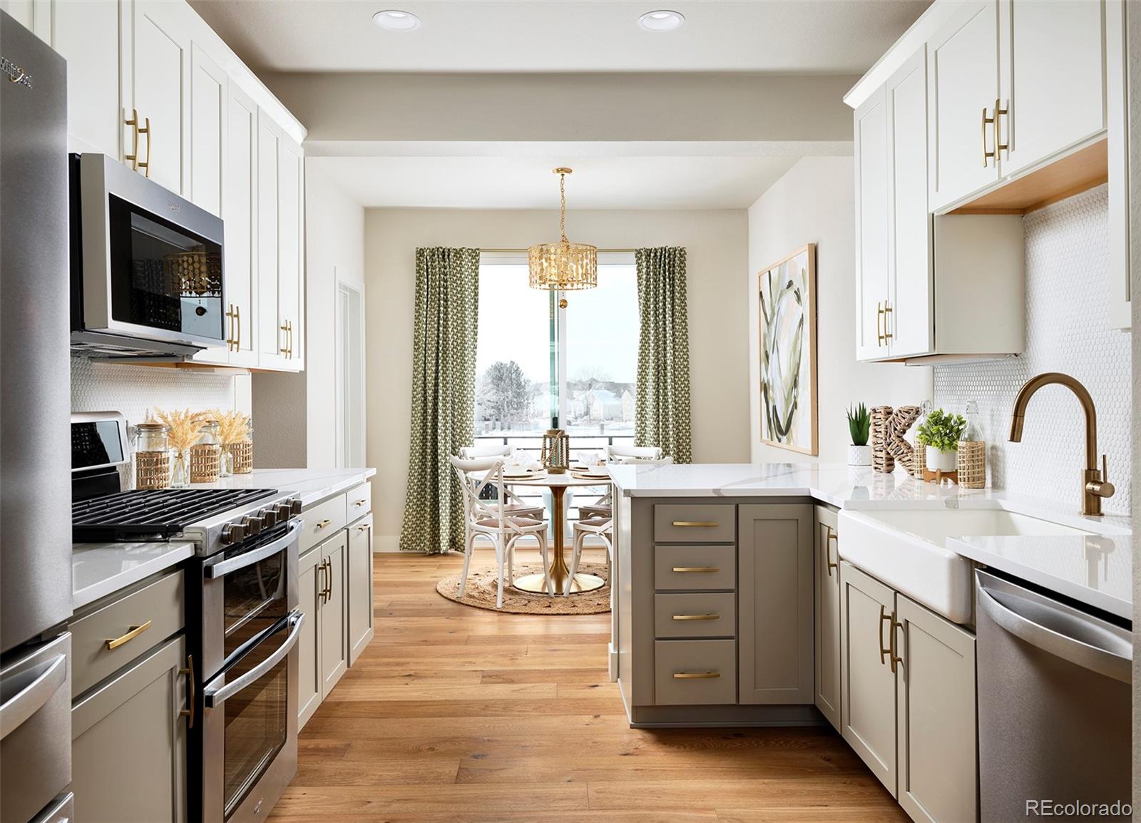 Model home designed by award-winning interior designer. Step into this 2-bedroom + office/flex space, 3.5-bathroom model home, complete with a stunning rooftop deck—your private oasis high above it all. The journey begins on the first level, where a welcoming front porch invites you in. Inside, you’ll find a sunny office with built in shelves, a ¾ bath, a convenient coat closet, and a 1-car garage. On the elevated second level, the main living space is bathed in natural light, with an open-concept layout that makes it perfect for both relaxing and entertaining. Enjoy meals in the dining room, where a covered balcony extends your living space outdoors. The kitchen, with a pantry and gas stove plus double oven, invites you to cook and gather around the breakfast bar, while the spacious living room, complete with a gas fireplace, is ideal for unwinding. A powder bath completes this level. The third floor is where you’ll retreat to rest, featuring two beautiful bedroom suites. The primary suite is a true sanctuary with a vaulted ceiling, dual sinks, and a picture window. The second bedroom suite offers a full bath and a walk-in closet. The laundry closet is also located on this level. The real showstopper is the rooftop deck—an intimate, expansive space with its own gas line, perfect for sunset dinners, stargazing, or just soaking in the surroundings. This home is steps from walking trails, offering tranquil outdoor living and easy access to nature. Prelude at TAVA Waters, a gated community by local builder Koelbel Communities, offers a private lake, scenic trails, mature trees, and a resort-style amenity center with a pool, hot tub, and state-of-the-art gym. Adjacent to the Highline Canal, it's just minutes from Lowry, Cherry Creek North, Anschutz, downtown, DTC, and DIA. Mortgage Rate Buy Down Incentives are available for this home. Ask the sales team about how we can help you lower your monthly payments.