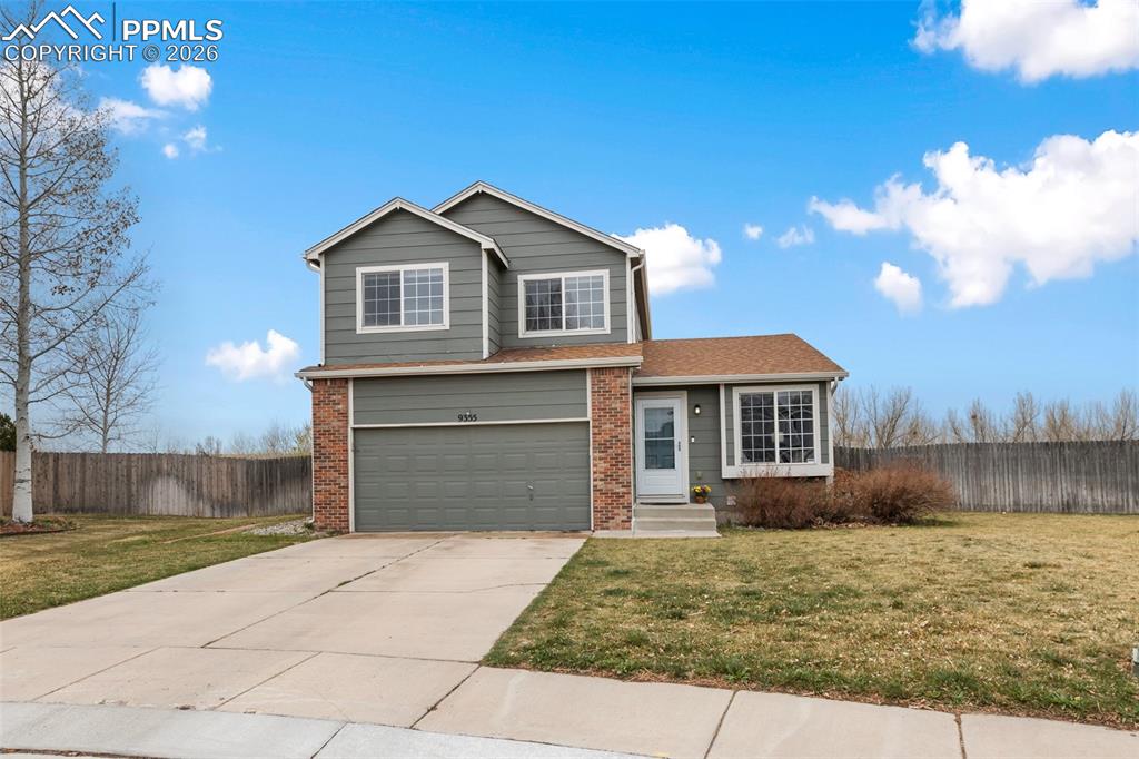 Beautiful two-story home in move-in condition! Situated on a premium lot backing to designated open space, Jimmy Camp Creek, and the nearby trail system. Enjoy Pikes Peak views to the west. The main level features newer luxury vinyl flooring throughout, along with an upgraded kitchen that includes granite countertops, white shaker cabinets, and a newer appliance package. The dining area features double doors that open to the rear patio and fully fenced backyard, creating a great space for outdoor living and entertaining. Vaulted ceilings in both the living and family rooms add to the bright and open feel of the home, and a convenient half bath is also located on the main level. Upstairs, the spacious owner’s suite includes an attached full bath with double vanities and a custom tile surround in the tub/shower combo. Bedrooms two and three are also located on the upper level, along with an additional full hall bathroom. The basement was recently finished with permits and feels fresh and new. It features a large bonus room perfect for entertaining, plus an additional nook that works well for fitness equipment or a flex space. A ¾ bath is also located in the basement. The home also includes a newer furnace and air conditioner, along with a two-car garage. All of this in a fantastic location close to open space, trails, and beautiful Colorado scenery.