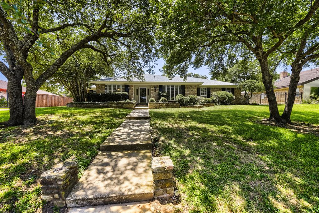 Seller offering up to 2.5% in seller credits to use towards rate buy down or closing costs with preferred lender. This inviting single-story brick home offers comfortable living and a bright, open atmosphere throughout. The spacious living area is filled with natural light and connects seamlessly to the kitchen, where beautiful stone countertops add both style and functionality. The thoughtful floor plan includes well-sized bedrooms and practical spacing that makes everyday living easy. Step outside to a large fenced backyard featuring your own private pool and an enclosed patio—an ideal setup for relaxing, entertaining, or enjoying quiet evenings at home. Mature trees provide abundant shade and create a peaceful outdoor retreat. Conveniently located near schools and shopping, this home blends open spaces, comfort, and a great location, making it an excellent choice for buyers seeking convenience and room to enjoy.