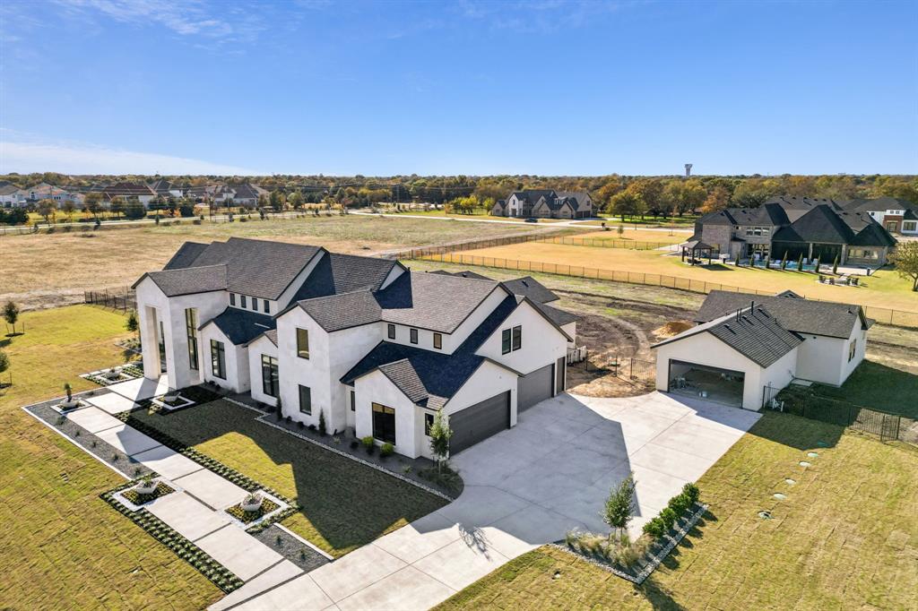 Welcome to 421 Calabrese Ct, a J. Anthony Custom Home under construction and located in the prestigious community of Fairview, within highly acclaimed Lovejoy ISD. This extraordinary property sits on a spacious lot and offers the perfect blend of luxury, functionality, and versatility.The main residence features 5 bedrooms, 5 full and 2 half baths, and a spacious 4-car garage. Designed for both comfort and entertaining, the open-concept layout is complemented by top-of-the-line finishes, soaring ceilings, and thoughtfully designed living spaces throughout. A gourmet kitchen, spa-inspired primary suite, and expansive living and dining areas make this home ideal for modern living. A pool rendering and plan are available for buyers to preview, allowing you to envision your own backyard oasis. Adding even more flexibility, the property includes a separate casita or guest home, offering 1,142 sq ft of private living space complete with 1 bedroom, 1.5 baths, a full kitchen, living area, and its own dedicated 2-car garage perfect for multi-generational living, guests, or a private home office. This one-of-a-kind property offers the best of Fairview living with excellent schools, shopping, dining, and quick access to major highways, all while enjoying the privacy and tranquility of an exclusive neighborhood.