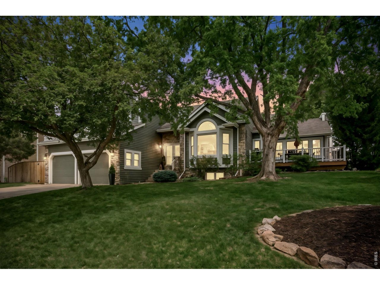 Welcome to Southridge Greens, where golf course living meets Colorado mountain views. This beautifully maintained 4-bedroom, 3-bath home backs to the 13th fairway and offers a bright, open floor plan designed for comfortable living and entertaining. The spacious kitchen features granite countertops, stainless steel appliances, a center island, and hardwood flooring, flowing seamlessly into the family room. Enjoy stunning Front Range views from the front deck and the private balcony off the primary suite. Formal living and dining rooms provide additional gathering spaces, while the finished daylight basement offers a large recreation room and abundant storage. It is Foco connect ready and it is Electric car charger ready. Outdoor living shines with mature landscaping, a private stamped concrete patio in the back yard and a newly finished deck off the front living room. Direct access to the nearby Power Trail is a great treat to have as well. Located in one of southeast Fort Collins' most desirable golf course communities, this home combines scenic beauty, thoughtful updates, and an exceptional location.