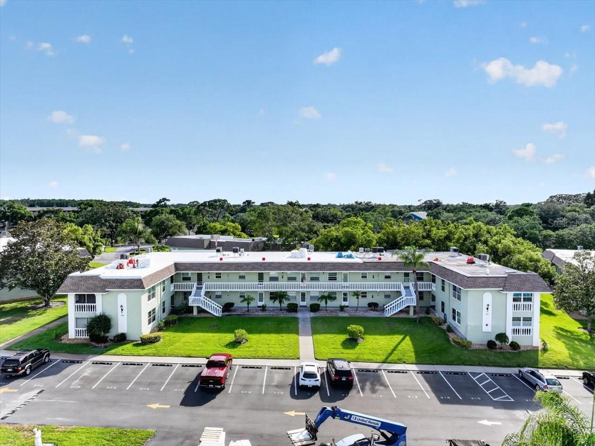 Welcome to easy Florida living in this updated, and Fully Furnished first-floor 1-bedroom, 1-bath condo in the vibrant 55+ community of Green Dolphin, near downtown Tarpon Springs. Fully furnished and move-in ready, this inviting home features a light and comfortable living/dining area, warm wood-look flooring, neutral paint, and tasteful furnishings throughout. The living room opens to an enclosed sunroom, offering a relaxing extra space for morning coffee, reading, or casual seating. The kitchen features wood cabinetry, white appliances, tile flooring, and a convenient flow to the dining area. The bedroom is comfortably furnished and offers private access to the sunroom, while the nearby bathroom feels bright and fresh with white tile, an updated vanity, and a walk in fiberglass shower. Updated include New AC in 2020, New Water heater in 2025, New walk in shower, Updated double pane windows, and New Electric panel in 2018. Enjoy a convenient location across from the heated pool and laundry room, making it easy to soak up the sun while taking care of a load of laundry. Green Dolphin offers resort-style amenities including two heated pools, a fitness center, tennis courts, pickleball, shuffleboard, a clubhouse with planned social events, game room with billiards and card games, a library, BBQ grills, and more. This pet-friendly community is beautifully maintained, and the low HOA covers basic cable, internet, water, sewer, trash, and exterior/grounds maintenance. No flood insurance is required, and the community is not subject to milestone inspections. Located along Pinellas Avenue near shopping, restaurants, medical services, downtown Tarpon Springs, the Sponge Docks, several beautiful beaches, and a short drive to Dunedin. Golf lovers will appreciate the adjacent Tarpon Springs Golf Course and nearby Innisbrook Resort, while outdoor enthusiasts can enjoy easy access to the Pinellas Trail. A welcoming, move-in-ready condo in a fantastic Tarpon Springs location. Schedule your private showing today!