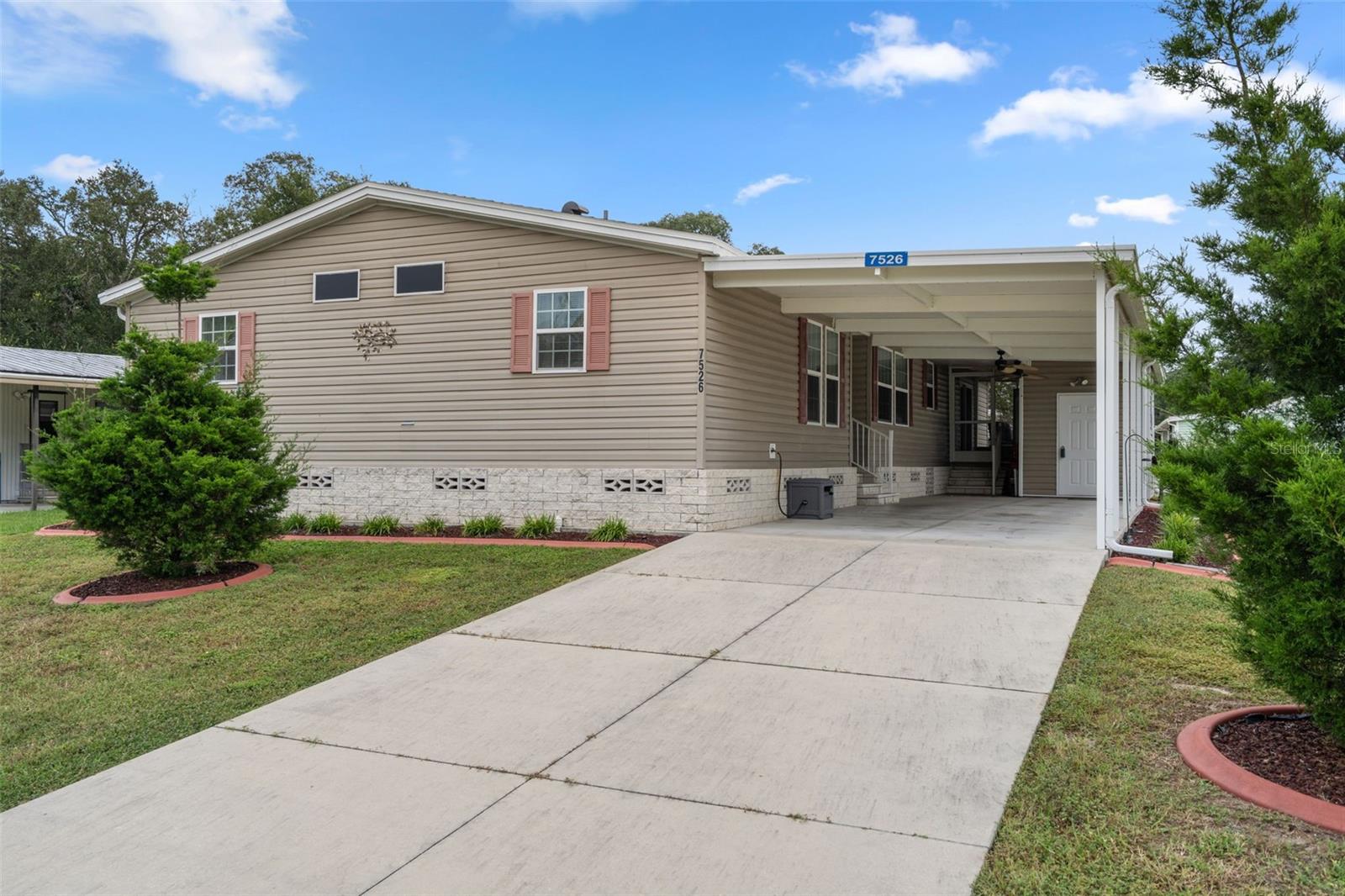 This spacious 2016-built home with over 2,000 sq ft of well-designed living space, features 3 bedrooms and 3 bathrooms. The heart of the home is the expansive kitchen, complete with a cozy breakfast nook, built-in desk area, and an abundance of cabinets and storage, along with an inside laundry room and pantry. The primary suite offers an adjoining office space, ex-large walk-in closet, and a private bathroom. Second & third bedrooms are nicely-sized with walk-in closets and share a bathroom. Open floor plan, wood laminate flooring throughout, and plenty of windows for natural light. Enjoy Florida outdoor living on your screened-in porch, along with utility/storage room and beautifully landscaped grounds.  Located in the fantastic High Point 55+ Community with access to top-notch amenities including golf, pools, clubhouse activities, and more. Close to shopping, restaurants, entertainment, and medical facilities. Low HOA fees and you OWN YOUR OWN LAND.*ACTIVE SECURITY CAMERAS ON PROPERTY*