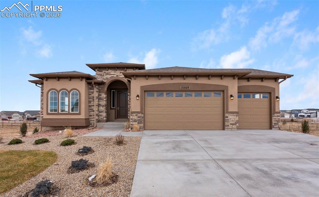 Gorgeous Garden Level Ranch plan with 5 bedrooms, 3 1/2 bath, and 3 car garage with full finished basement! The chef kitchen features stainless steel appliances, a gas range, range hood, wall microwave and wall oven, granite countertops, designer staggered cabinetry, large island with pendant lights, pantry, and dining nook with oversized sliding doors that lead to covered deck patio.  The kitchen is open to the great room featuring gas fireplace, a grand double coffered high ceiling, and windows that give lots of natural light.The master suite with 5 pc bath, formal dining, laundry, mudroom, powder room, bedroom, full bath and entry complete the main level of this spacious ranch home.  The expanded master includes coffered ceiling and open to the master bath with large shower, large tub, quartz countertops at dual sinks, private commode, and large walk-in closet with additional door leading to the laundry room for convenience!Finished basement with 3 bedrooms,  2 full baths, rec room and game room are located below.  Additional features include 8 ft garage door, ceiling fan prewires, AC, 50-gallon water heater, 90% Energy Efficient Furnace, Moen plumbing fixtures, and more!This home was designed for performance and energy efficiency and has received a HERS score. As a result, you should see savings on your utility bills. Schedule your appointment for viewing today!