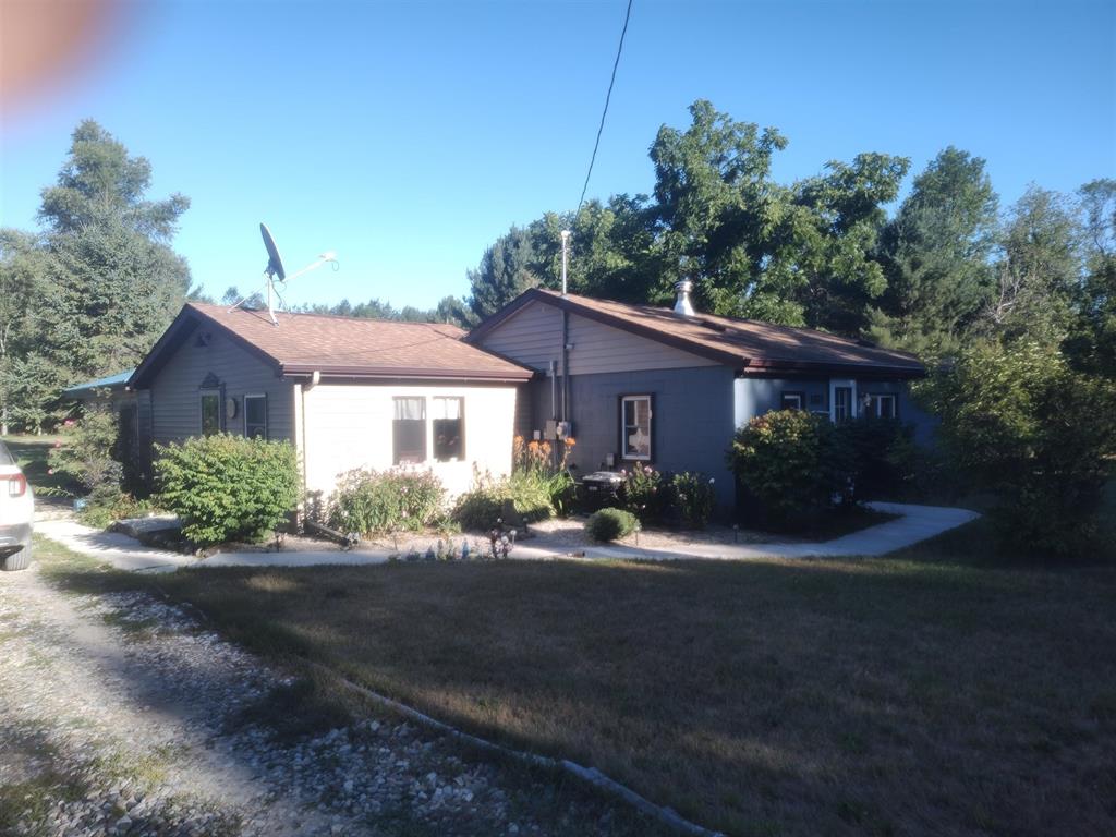 Welcome to your private northern Michigan retreat! This well maintained two bedroom home sits on 29 wooded acres between Whittemore and Tawas City, offering privacy, comfort, and endless outdoor recreation. Updates included a tankless on demand water heater. reverse osmosis system, at the kitchen tap, roof replacement in 2010, forced-air furnace with central air, and living room carpet less than 1 year old. The woodburning stove can heat the entire home if desired. The spacious open kitchen and dining area flow into a comfortable livingroom, while seasonal room offers a peaceful wooded view. The property was recently surveyed with perimeter stakes every 200 feet. Outside, you'll find manicured ATV and walking trails, fruit trees, and a food plot attracting abundant wildlife and excellent hunting opportunities. The property has two well built permanent blinds and is adjacent to State land. The Augres River is just a short walk through the forest to the west perfect for fishing or exploring. A 24 x 40 polebarn with cement floor and 3 lean-toos provide ample storage for equipment and outdoor toys. There is also potential to build an additional home or guest house on property's northwest corner offering fliexibility for expansion or guest accomodations. Meticulously cared for and move in ready, this move in ready property is ideal as a year around home, vacation getaway, or sportsman's paradise.