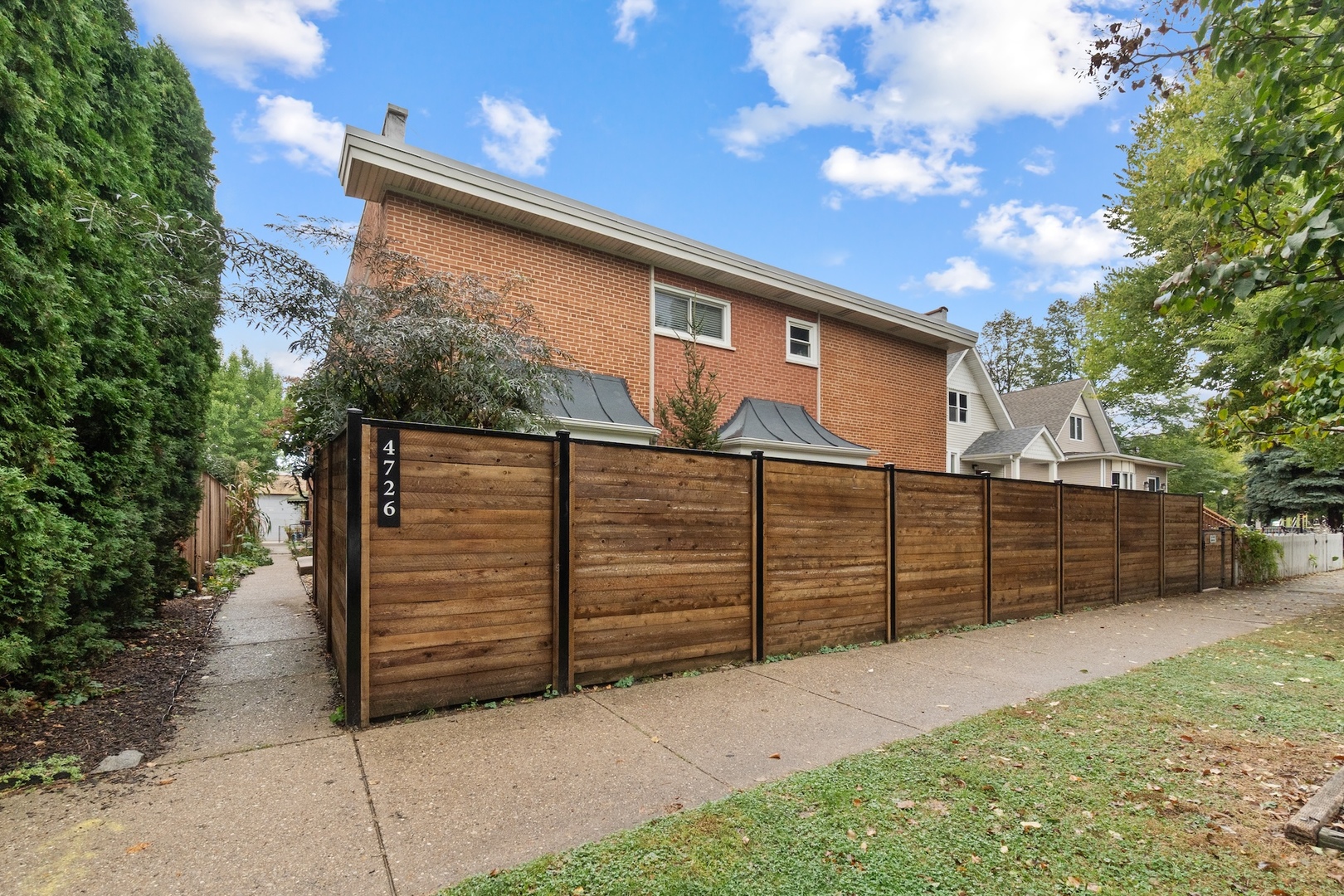 Enjoy the best of Lincoln Square and Ravenswood in this spacious, updated three-bedroom, one-and-a-half-bath townhome offering three levels of comfortable living on a quiet cul-de-sac. The bright main level features a 29 x 17 open-concept living and dining area, perfect for entertaining, and an updated kitchen with granite counters, stainless-steel appliances, custom cabinetry with under-cabinet lighting, and a built-in banquette breakfast nook. Upstairs, the large primary bedroom is joined by two additional bedrooms with custom closets and a covered deck for morning coffee or evening relaxation. The lower level provides a generous family room and a separate laundry and storage area with newer Maytag washer and dryer (2025).  Recent updates include a new Carrier furnace and A/C (2024), rewired fuse box and upgraded kitchen outlets (2021), windows and doors replaced (2022), roof resealed (2019), tuck-pointing completed (2019), parking area repaved (2025), and a new fence between buildings (2025). The dishwasher was replaced in 2025, complementing the Maytag refrigerator, washer, and dryer, and Whirlpool range.  Situated in an ideal location near McPherson Elementary, the EL and Metra, Mariano's, and countless neighborhood restaurants, this home offers unbeatable convenience with a true community feel. Nestled at the end of a quiet street with no through traffic, it's also just minutes from Lincoln Square, Andersonville, and popular music venues, shopping, restaurants, boutique shops.