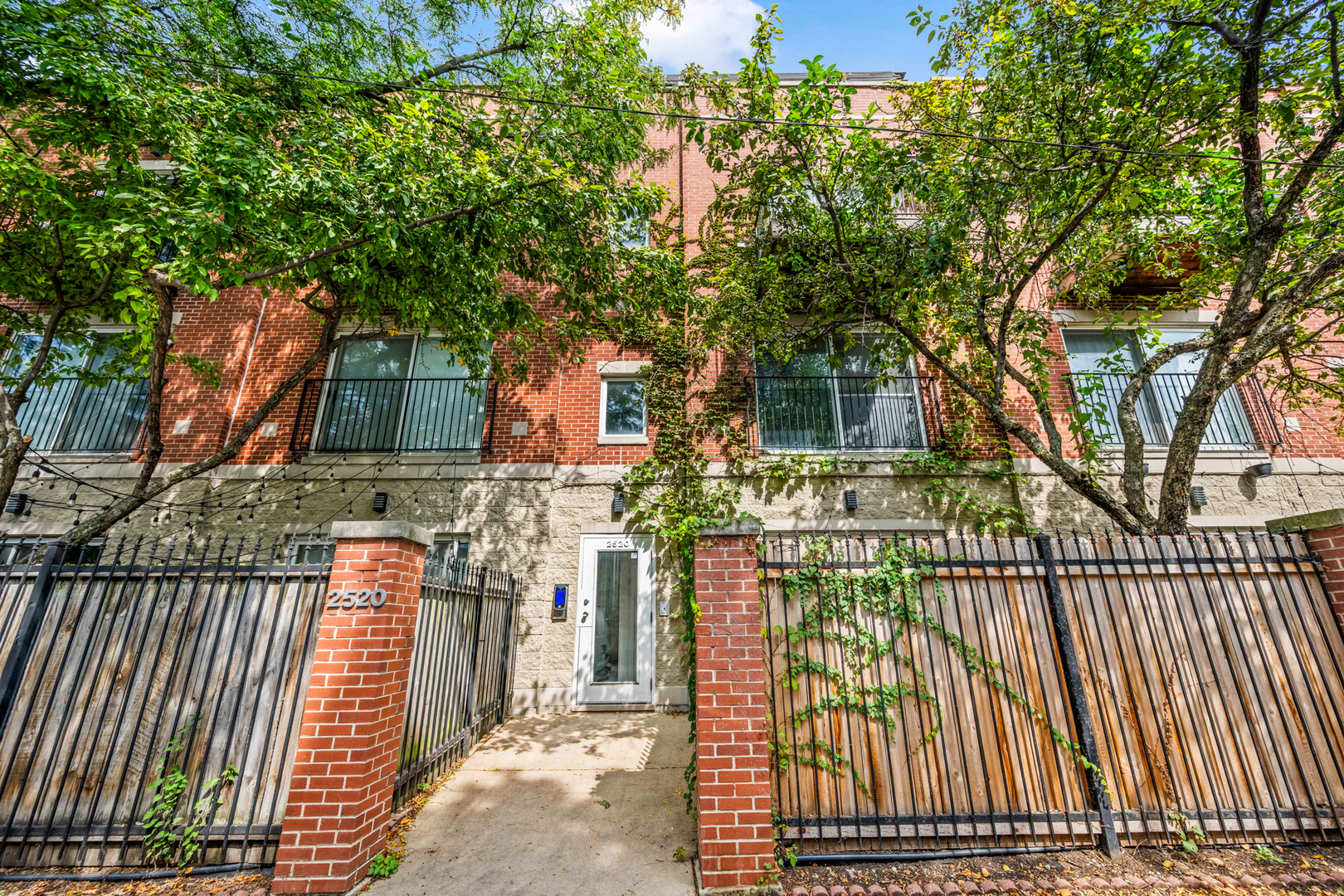 Located just steps from the 606 Trail, this updated 2-bedroom, 2-bath duplex condo at 2520 W Bloomingdale offers a blend of modern finishes and everyday convenience.    The main level features an open living and dining area with hardwood floors, a gas fireplace, and a renovated kitchen outfitted with granite counters, soft-close cabinetry, and a large peninsula ideal for entertaining. From here, step out to your private fenced patio-perfect for grilling or relaxing. Direct access to the attached garage provides parking plus additional storage.    Upstairs, the king-sized primary suite includes a walk-in closet, ensuite bath, and Juliet balcony overlooking the trail. A second spacious bedroom, full bath, and in-unit laundry complete the upper level.    With easy access to the Blue Line, nearby restaurants, shopping, and nightlife, this move-in ready condo offers the perfect mix of home comfort and city living.