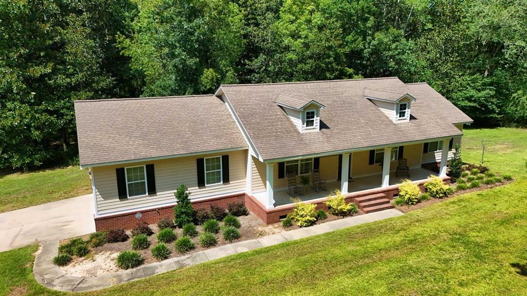 Escape to your own private country oasis on over 6 acres, perfectly located with quick access to Thomasville, GA, downtown Cairo, GA, and Tallahassee, FL. This beautiful 3-bedroom, 2-bath home boasts an open floorplan with a spacious living area, a modern kitchen featuring an eat-in island and ample counter space, and a master suite with a walk-in closet and private bath. Enjoy outdoor living at its finest with a tranquil pond, a full-length rocking chair front porch, and a large deck ideal for entertaining or relaxing while taking in the peaceful surroundings. This property is a hunter's and angler's paradise, with deer, turkey, and excellent fishing right on-site. Additional features include a large laundry room, a 2-car garage, and plenty of room to expand. Combining privacy, country charm, and convenient access to major South Georgia and North Florida cities, this property is perfect for families, outdoor enthusiasts, or anyone looking to enjoy the best of rural living near Thomasville, Cairo, and Tallahassee.