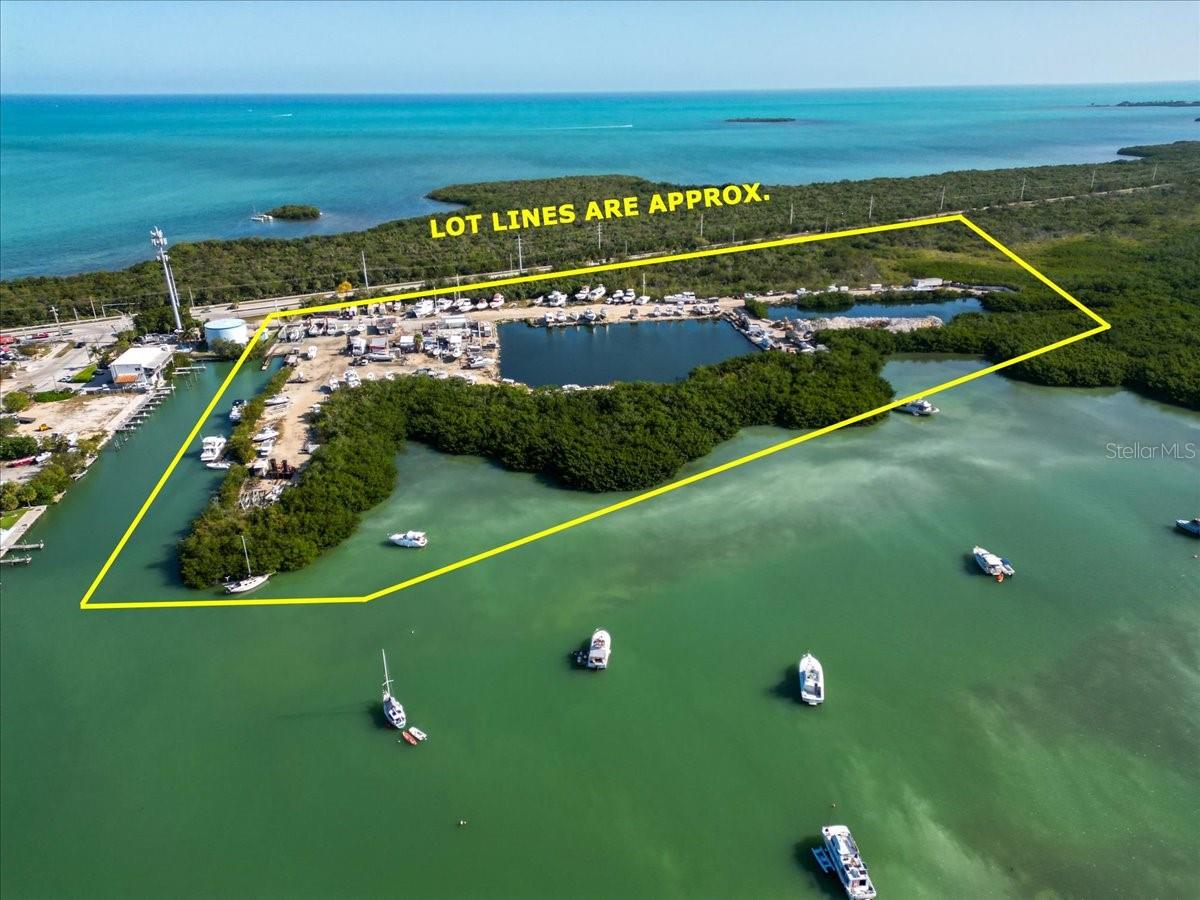 OVER 20 ACRE LAND AND MARINA ON OCEAN SIDE WITH FANTASTIC BUSINESS OPPORTUNITY IN MARATHON FL....Driftwood marina and storage has been in business for many years and now needs new owner to take over and replace the buildings and create new business venture and marinas and build ocean front resort hotel for visitors coming to Marathon.