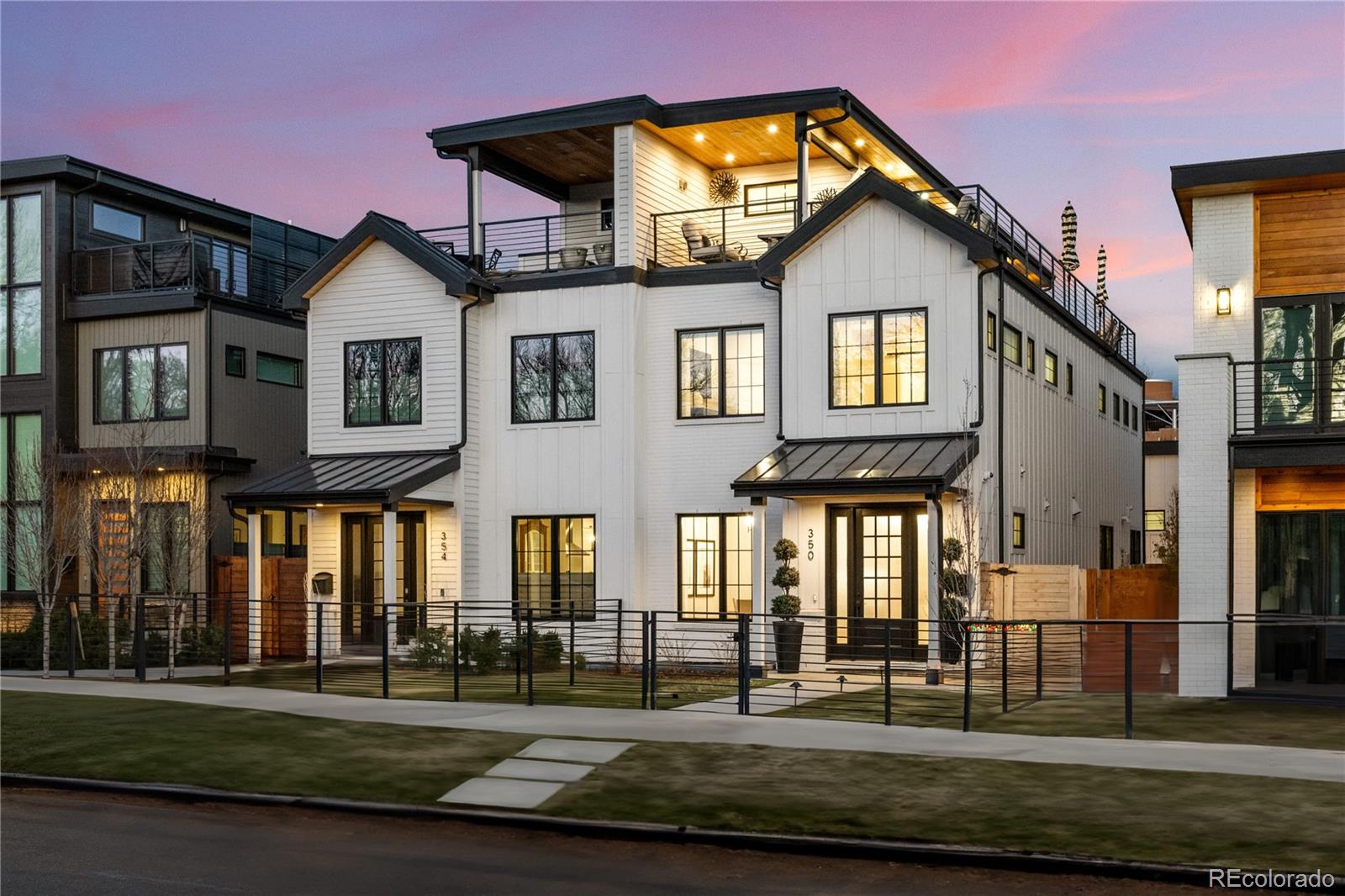 Experience elevated living in this elegant newer built residence in the heart of Cherry Creek North. This turnkey home offers three spacious bedrooms, five upscale bathrooms, and an expansive open-concept layout tailored to modern living and entertaining. Expertly curated designer finishes make an immediate impression as wide-plank white oak floors lead to the showpiece chef’s kitchen, anchored by Wolf and Sub-Zero appliances, sleek floor-to-ceiling cabinetry, and a striking quartz waterfall island. The breathtaking kitchen flows seamlessly into a sunlit family room with a statement fireplace and oversized multi-slide glass doors opening to a private patio for indoor-outdoor living.Upstairs, an airy floating staircase leads to a sophisticated primary retreat with a spa-inspired five-piece bath, heated floors, steam shower, and a luxurious soaking tub. The secondary bedroom features an ensuite spa bath and walk-in closet, while a conveniently located hallway laundry adds everyday ease. The third level is an entertainer’s dream, showcasing a designer wet bar with a pass-through window to the rooftop deck and bar, a double-sided fireplace, a bonus room or office, and panoramic Cherry Creek and Mountain views.The fully finished basement is designed for flexible living, offering a generous family room with a linear fireplace, a glass-front wine display, a guest suite with private laundry, a stylish bath, and a dedicated workout room. Perfectly situated in coveted Cherry Creek, this refined residence places upscale shopping, premier dining, and vibrant neighborhood amenities just one block from your door—delivering the ideal blend of luxury and lifestyle.
