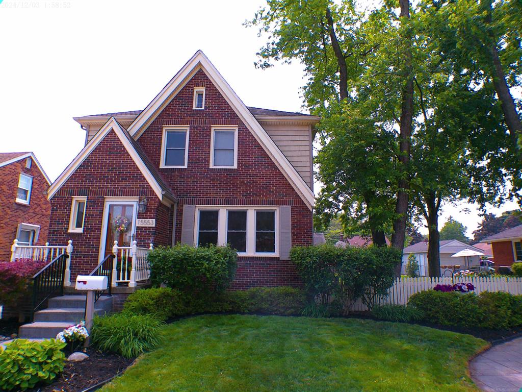 This Tudor home is situated on large landscaped fenced double lot. Hardwood floors throughout, open concept updated kitchen opens to living room with electric fireplace and main floor great room with stone natural fireplace, granite counters (level 5 color), dining room with Swarovski Crystal Chandelier ( stays with house) Second floor has high end finishes jetted tub, marble floor and three spacious bedrooms, Lower level is finished with oversized laundry room and another great room/ TV room.