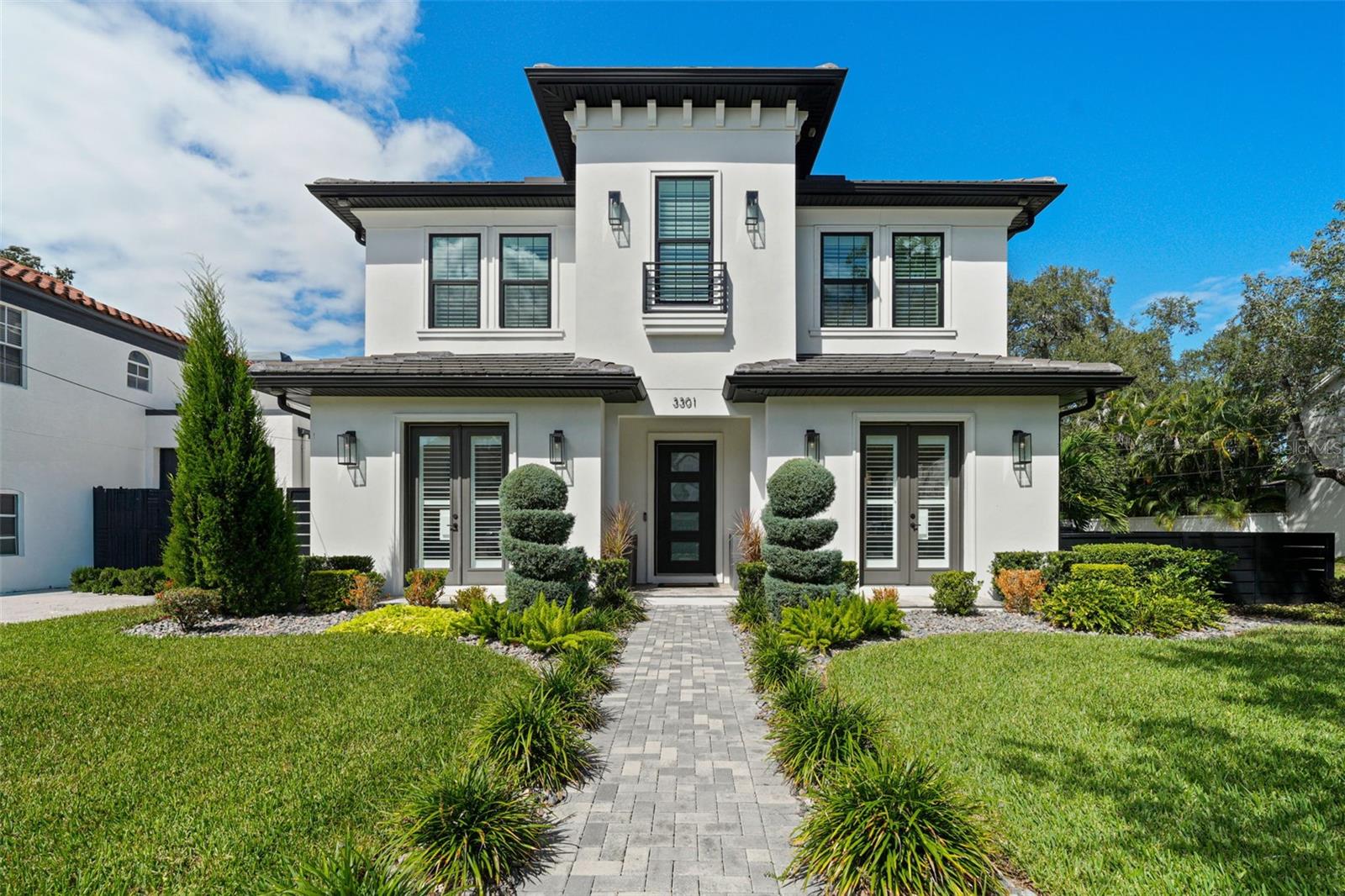 Under contract-accepting backup offers. Welcome to this exceptional opportunity! Situated 17 feet above sea level, on a corner lot in the highly sought after Bayshore Beautiful, awaits your new home. You will love the exceptional style of this 2022 Livistona home in addition to the improvements made by its current owners.   It is the best of all worlds; the ease of newer construction with the added benefit of built out closets, window treatments, upgraded lighting, added millwork and more!  Upon entering, note the high ceilings, hand scraped wood floors, and crown molding throughout the home offering a sense of luxury and craftsmanship. To your right find a spacious formal dining room with custom wood trim. To the left, a private room with French doors and a shiplap accent wall offers an ideal space for work or reflection.  The dining room and kitchen are seamlessly connected by a Butler’s pantry featuring custom cabinetry, a custom glass tile backsplash, sink, beverage fridge, and a walk-in pantry for ample storage.   The kitchen itself is designed for entertaining, with a vast island where guests can gather and converse with the chef. Culinary enthusiasts will appreciate the JennAir 6-burner gas cooktop, Thermador custom built-in 90-bottle wine fridge, and built-in JennAir microwave, oven, and refrigerator. The Calacatta Lazio quartz countertops and ceiling-high maple cabinets with European styling elevate the space. For casual meals, a cozy breakfast nook is also available.  The family room boasts a gas fireplace and sliding doors that lead to a screened patio, providing a comfortable space to dine al fresco. The outdoor kitchen is equipped with a grill, sink, and beverage fridge, making it perfect for gatherings. Enjoy the saltwater pool and spa for relaxation, or activate the multi-colored lighting for vibrant poolside parties. The detached garage includes additional storage that could be transformed into a poolside cabana. A covered breezeway links the garage to the mudroom off the kitchen, which features a custom bench, cabinetry, and unique wallpaper on the ceiling for added character.  Guests will also appreciate the downstairs guest suite and full bath (with access to the pool area).  Upstairs, the primary is spacious and features a tray ceiling.  The primary bath has offers a custom 72sf shower with separate zones, 6 shower heads, a large bench and two entries.  There is a dual sink vanity and fabulous soaking tub too.  The walk-in closet is oversized and features an island.  The current owners added a door between the primary and an adjoining bedroom, making it perfect for a nursery.  That bedroom also has a full bath.  Bedrooms 3 and 4 have a jack and jill bath in between with separate vanities.  All the showers have been upgraded to include glass doors.   The laundry room is thoughtfully designed, featuring a sink, cabinetry, hanging rack, shelves, and a beverage fridge—making laundry almost enjoyable.  Looking for some space to play outside?  The side yard features a custom metal fence and room to run!  Or take a bike ride or walk to Bayshore, it’s just a few blocks away.  The YMCA is also a 2-minute stroll.  Conveniently located near Target, Publix, downtown, TPA and A rated schools (Roosevelt, Coleman and Plant), this beauty truly offers it all!  Schedule your showing today!