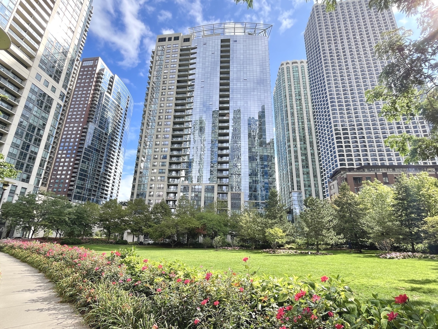Sun-filled living and stunning views define this 2-Bed, 2-Bath residence at The Lancaster, a prestigious Skidmore, Owings & Merrill-designed condominium in the heart of the New Eastside. Floor-to-ceiling windows and a private west-facing balcony showcase forever-unobstructed skyline views while overlooking the lush, tree-lined Lakeshore East Park with its vibrant gardens, meandering stream, and tranquil waterfall. The thoughtfully designed kitchen features granite countertops, cherry wood cabinetry with glass-lit uppers, under-cabinet lighting, a built-in wine cabinet, breakfast bar, and abundant counter space, perfect for both everyday living and entertaining, while the primary suite includes a custom walk-in closet and spa-inspired bath with heated floors, dual sinks, a soaking tub, and separate shower. The versatile second bedroom adapts beautifully as a guest retreat, home office, or den, enhanced with a masterfully designed Queen Murphy bed with shelving and storage. Additional highlights include gleaming hardwood floors, newer Cafe stainless steel appliances with double oven (air fryer and convection features), in-unit washer and dryer, custom remote-control blinds, and abundant natural light throughout. Residents of The Lancaster enjoy full-service amenities including 24-hour door staff, on-site management and engineer, a fully equipped fitness center, stylish party room, office space, and a spectacular sundeck with sweeping views of Lake Michigan, Maggie Daley Park, and Millennium Park, plus grilling stations, multiple lounge areas, storage, and bike facilities. Perfectly located, this residence is steps from Mariano's, boutique grocers, the Chicago Riverwalk, the lakefront trail, playgrounds, a dog park, world-class shopping along the Magnificent Mile, and endless dining and cultural attractions. Investor friendly, pet friendly (no weight limit), with garage parking space #198 available for $35,000.