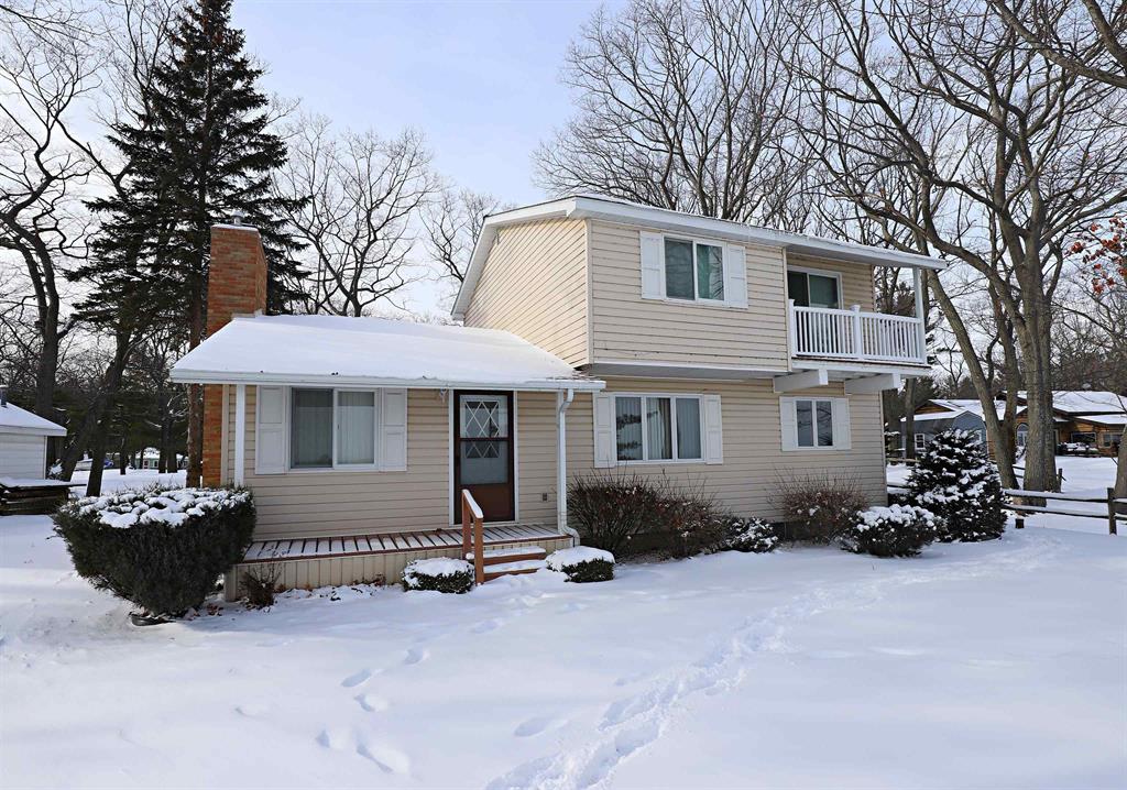 Spectacular Lake Huron home with 67 feet of pristine sandy beach! This one-owner, quality-built home offers stunning water and island views and adjoins a boat inlet, just across from Huron Breeze Golf Course. Features include Andersen windows, a cathedral-ceiling great room with fireplace, and multiple outdoor living spaces, including decks on the front, back, and second floor, plus a dedicated beach deck, perfect for taking in the serene wooded surroundings and lake views. The KraftMaid maple kitchen comes fully equipped with all appliances. The main floor is prepped for a first-floor laundry. The lower-level egress basement is ready to finish for additional living space. Oversized 24x22 garage, Generac generator, municipal water, separate well for sprinklers, and two updated seawalls complete this exceptional waterfront retreat.