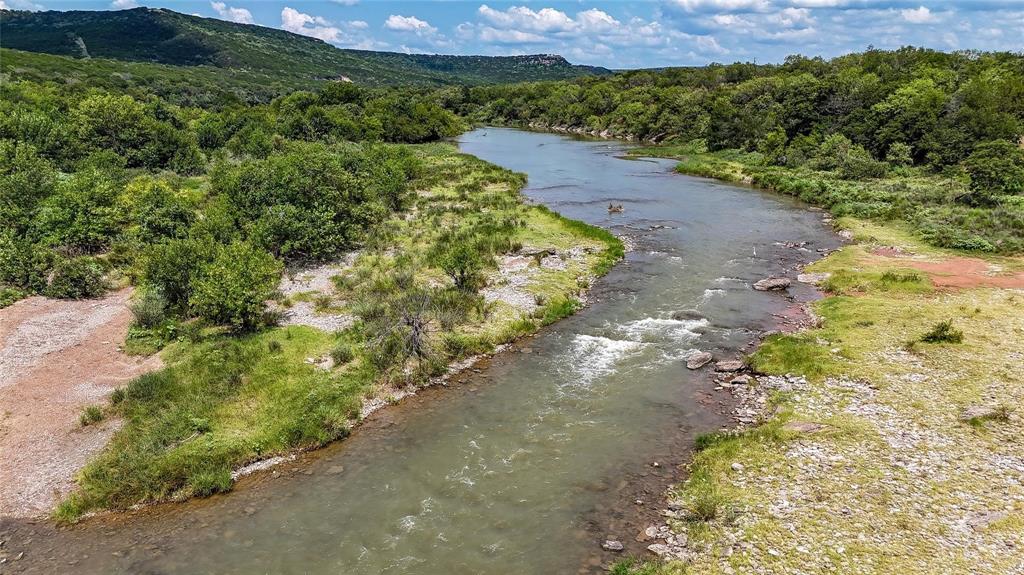 Beautiful 10 acre tract in the sought after Fortune Bend ranch development. This property has access to the most pristine part of the Brazos River. Located just a few miles down from the Possum Kingdom dam, the Brazos has constant flow with clean and clear water. Enjoy fishing, kayaking, tubing, and swimming in cool water year around. Tons of wildlife roam Fortune Bend including whitetail deer, turkey, and dove. Great tract to build a weekend getaway for the family. You won't even feel you are in north Texas with the giant bluffs and cliffs surround the property. You can also vrbo your home for outdoor enthusiast wanting to relax and enjoy the countryside. Schedule a showing and see why Fortune Bend is one of the most sought after ranch developments in Texas.
