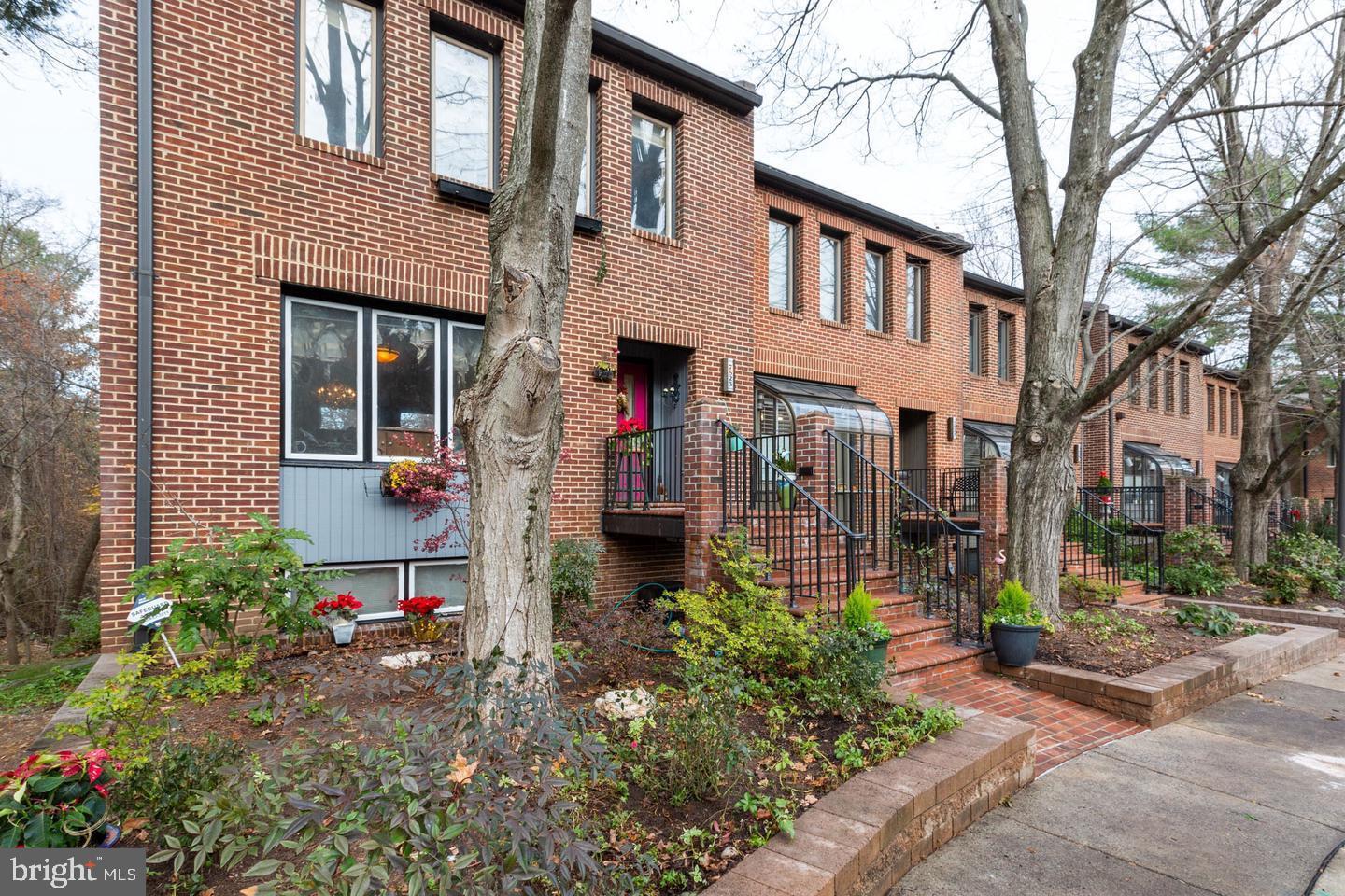 Immaculate and move-in ready, this striking contemporary townhome features soaring 12-foot ceilings, abundant natural light from skylights, and a beautifully open layout ideal for both everyday living and entertaining.Located within a top-rated school district, the home also offers the convenience of a Ride-On shuttle just outside the door to the Bethesda Metro, making commuting effortless. Enjoy luxury, low-maintenance living surrounded by the serene, wooded setting of the highly desirable Bethesda Crescent community.Distinctive architectural details include exposed brick accents, hardwood flooring throughout, and multiple skylights. Outdoor living is equally inviting, providing the perfect space for relaxing or entertaining. For added convenience, the home includes a fully finished walk-out lower level with a second kitchen and an additional washer, offering excellent flexibility for extended living.The lower level functions beautifully as an in-law or guest suite, featuring a bedroom, living area with fireplace, renovated full bath, and a flagstone patio overlooking the peaceful, tree-lined views of the Bethesda Country Club.As an added bonus, the owners are open to offering a credit for buyers who wish to personalize interior colors to suit their design preferences. This is a rare opportunity to own a thoughtfully designed, one-of-a-kind home in one of Bethesda’s most sought-after neighborhoods.