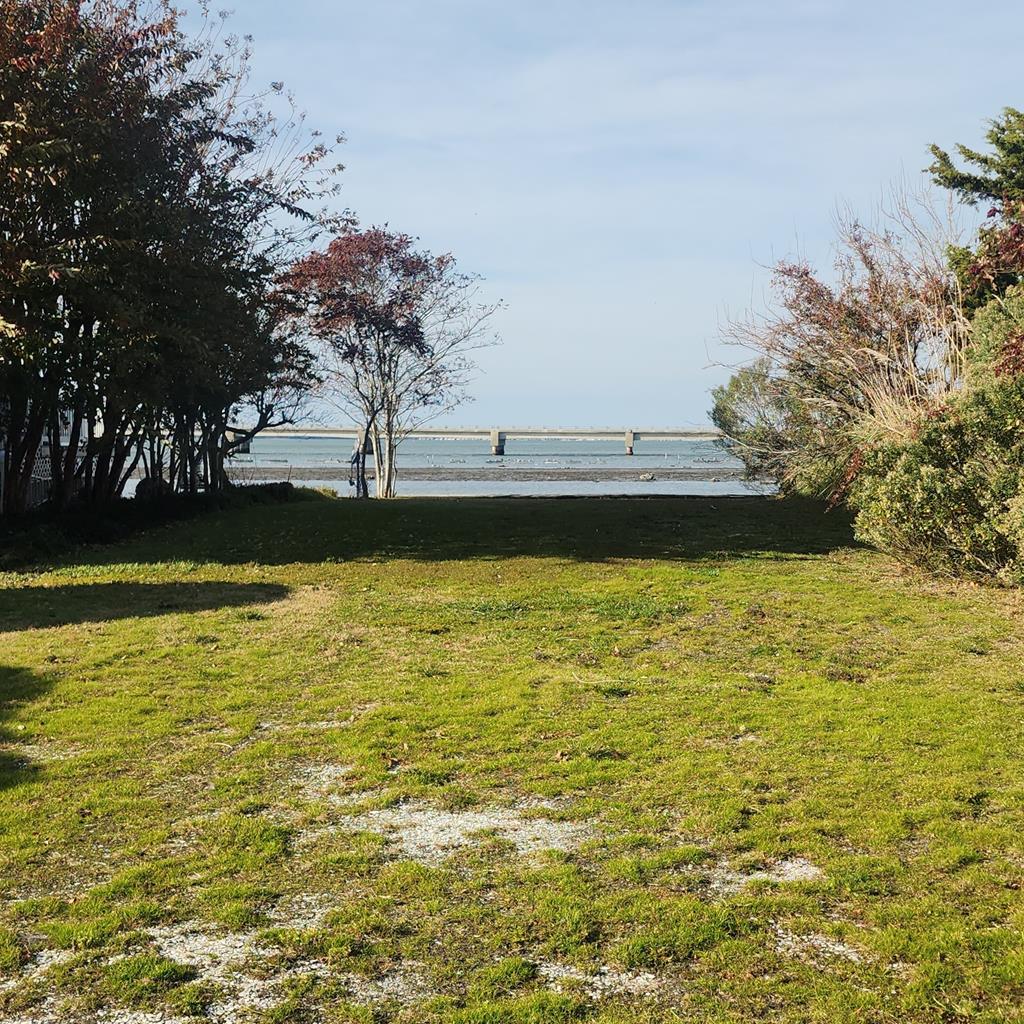 Nestled on the tranquil Chincoteague Bay, Lot 5 Marsh Island Drive offers a rare opportunity to claim your own slice of island paradise. This waterfront lot boasts breathtaking views, gentle coastal breezes, and direct access to the stunning waters that made Chincoteague so beloved. Enjoy sunsets dancing across the water with unparalleled natural beauty known here on the Eastern Shore. Your waterfront dream begins here. Buyer to verify all building, septic and utility availability.