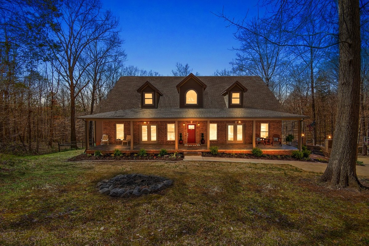 If you're looking for a house that helps you unwind from the busy hustle and bustle of life, this is the perfect home for you. This 6,418 sq ft property was built with quality and detail in mind. As soon as you enter the fantastic, covered front porch and step inside, you start to admire this home. The office is located to your right, featuring a framed coffered ceiling, a professional exhaust system (cigar room), and soundproofing that can open to the outside. To your left is a spacious dining room that also opens onto the outside porch. Straight ahead is the living room, ready for a romantic fire in the fireplace and breathtaking views from the wall of two-story windows. The gourmet kitchen is everyone's dream for entertaining or family meals. All the bedrooms are spacious, with walk-in closets. Every room boasts a unique view from its large windows overlooking the private yard. Let’s talk about basements; finished and ready for whatever you dream of. In-law apartment, entertaining space, fully plumbed for a second kitchen. The basement also has a large bathroom, a non-conforming bedroom, and a storm shelter. So much more to talk about, but let's go outside! 9.34 acres, approximately 750 ft of water frontage on Passenger Creek. The property is secluded in the woods and borders approximately 140 acres of protected green space on the northern boundary. The property currently features a large Terraced Garden with mature asparagus, blackberry, blueberry, fig, raspberry, and elderberry plants—approximately 650 square feet of terrace vegetable and flower gardens. This is the perfect property to call home!