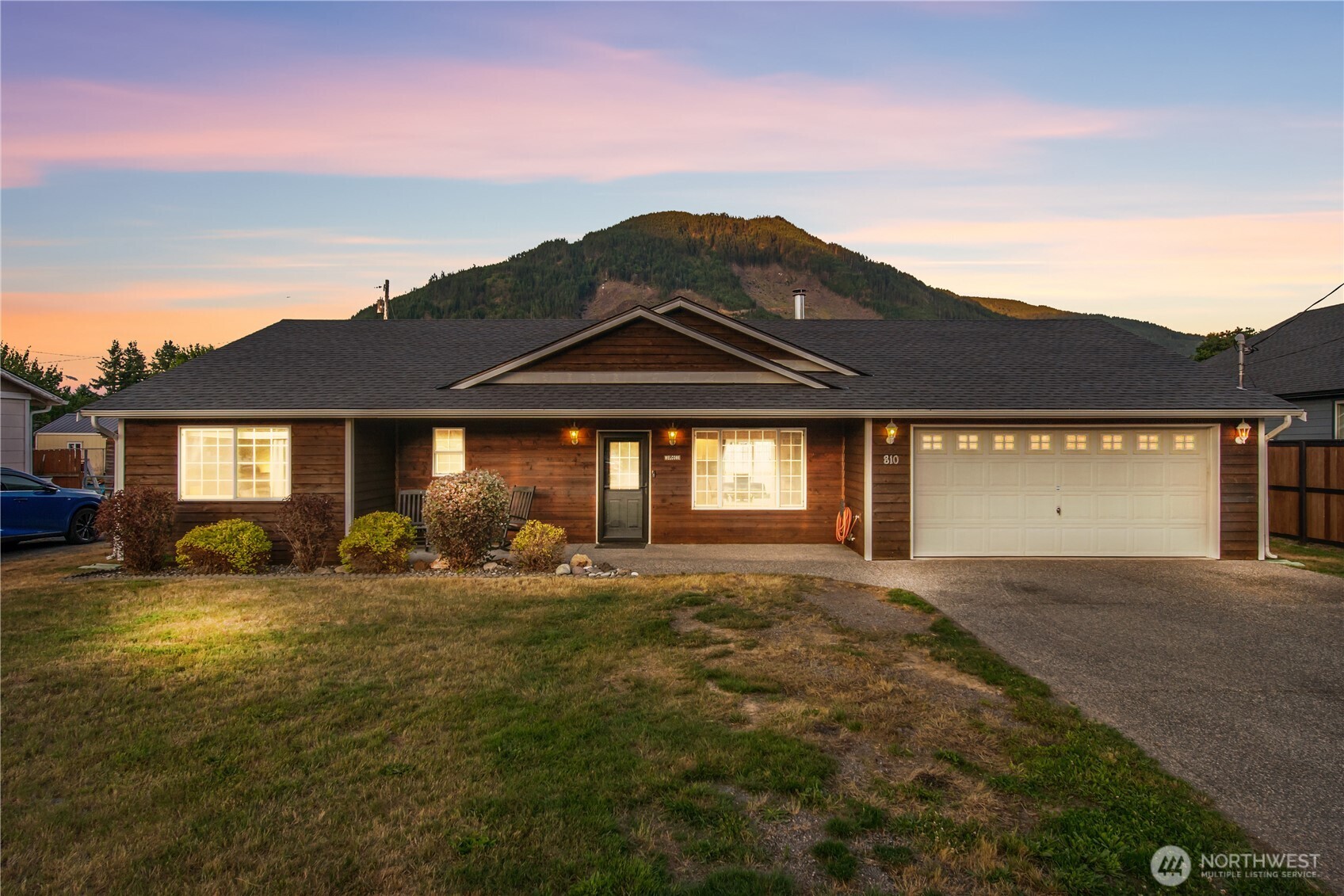 [DISCOVER YOUR DREAM RETREAT] Nestled in the scenic North Cascades with unbeatable mountain panoramas. This charming rambler offers 4 spacious bdrms- 1,374 sq ft of tastefully designed living space. Vaulted ceilings & a cozy wood-burning fireplace anchor the layout, perfect for gatherings or relaxing evenings. Stylish open-concept kitchen complete with ample pantry storage, & a sliding glass door that leads seamlessly to the patio, ideal for indoor-outdoor living . More than just a house—this is a lifestyle. Whether you're captivated by mountain views from your porch, cozy nights by the fireplace, or easy access to Cascades adventures, this home delivers. The new roof adds safety, value & peace of mind.[THE BEST OF PACIFIC NORTHWEST LIVING]