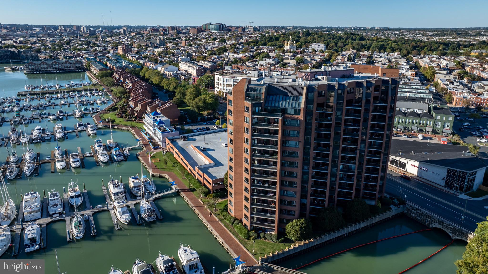 Welcome to Unit 907 at the Anchorage Towers, your waterfront retreat in the heart of Canton! Step into this stunning 2 bedroom, 2 full bathroom condo and discover a perfect blend of waterfront living and urban convenience. Nestled in one of Baltimore's most vibrant neighborhoods, this unit offers breathtaking water views and easy access to everything the city has to offer. Upon entering, you’ll be greeted by an open, sunlit living space with large windows that flood the room with natural light. The hardwood floors and modern finishes create a stylish, welcoming atmosphere. The living area flows effortlessly into the dining space, ideal for hosting gatherings or enjoying quiet meals. The updated kitchen is a chef’s dream, featuring sleek stainless steel appliances, ample countertop space, and plenty of storage. Imagine preparing meals while gazing out over the tranquil water below. Both bedrooms are generously sized, providing a peaceful escape at the end of your day. The primary bedroom includes an ensuite bathroom and a spacious closet, offering both comfort and privacy. Step out onto your private balcony, where you can enjoy the spectacular waterfront views. Whether you’re sipping your morning coffee as the sun rises or unwinding with the evening’s city lights reflecting on the water, this space is your personal oasis. This condo also offers a range of amenities, including a fitness center, an additional storage space, two assigned and separately deeded garage parking spaces one of which has an EV charger, new carpet, and newer appliances. The location couldn’t be more ideal, conveniently located across from Safeway and steps from local shops, restaurants, waterfront parks and entertainment, making it the perfect place to experience the best of city living. Quick easy access to I-95, city transit, and the water taxi, don't miss your opportunity to call this unit home.