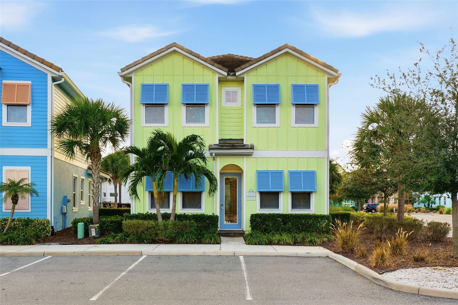 Experience resort-style living in this stunning 5-bedroom, 5.5-bath cottage located in the highly sought-after Margaritaville Resort Orlando. Perfectly positioned on an oversized corner lot, this home offers exceptional privacy along with its own private pool and heated spa, creating the ideal setting for relaxation or entertaining.This beautifully designed two-story floor plan comes fully furnished, with every detail thoughtfully selected to create a light, airy, coastal atmosphere. Soft mint and pastel yellow tones, wood-plank tile flooring, and energy-efficient stainless steel appliances all come together to provide both style and function. Natural light fills the home, enhancing the bright “beach breeze” ambiance throughout.The layout features two bedrooms on the first floor and three bedrooms upstairs, including a spacious primary suite. Each of the three second-floor bedrooms boasts its own en-suite bathroom, ensuring comfort and convenience for guests. The two upstairs guest rooms offer private balconies, while the primary suite also enjoys access to outdoor space for peaceful moments of retreat. A dedicated half-bath off the lanai adds extra ease for poolside living.Located within Margaritaville Resort, residents and guests enjoy world-class amenities and a prime location with quick access to major highways, shopping, dining, and—best of all—the Disney parks. Whether you're seeking a high-performing short-term rental investment or a beautiful place to call home long-term, this cottage embodies the ultimate laid-back Florida lifestyle.