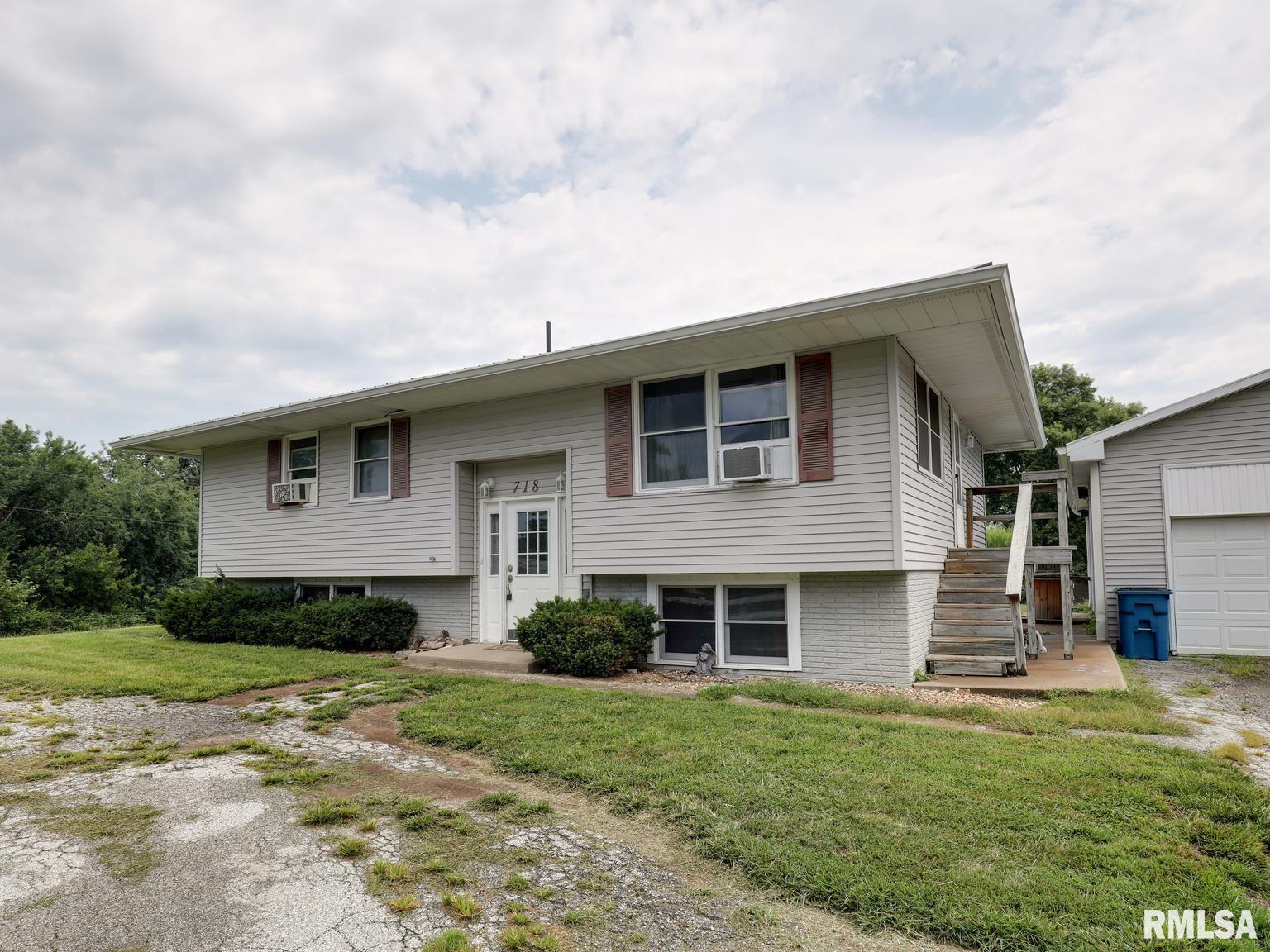 Space, Storage, and Serenity on the Edge of Town! Welcome to 718 W Tolton Dr. This 4-bedroom 1-Full Bath Home offers plenty of space for, guests and entertaining, the partially finished basement area is perfect for a rec room, gym, or den. Sitting on an almost half-acre lot you will have room to breathe and country style privacy with city conveniences just minutes away. The Spacious 35x31 detached 2 plus car garage will give you room for parking, storage, and a workshop area. Call us today to schedule your appointment. Stove and Refrigerator to convey. Furnace to be installed before closing. More Pictures coming 8/6/26